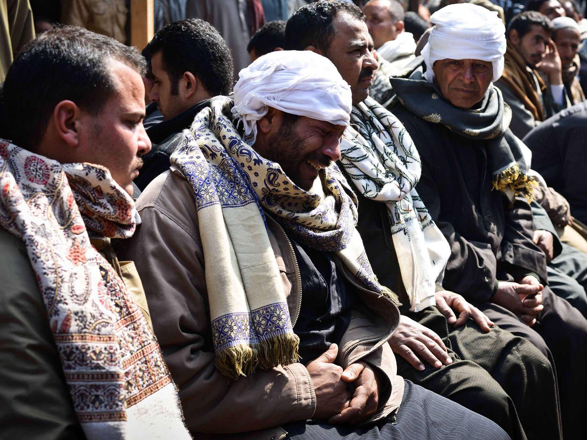 Relatives of Egyptian Coptic Christians murdered by Isis militants in Libya react after hearing the news