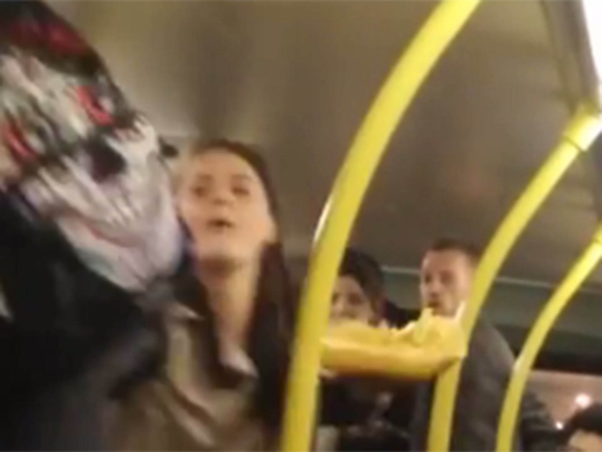 A woman throws punches while holding a tray of chip