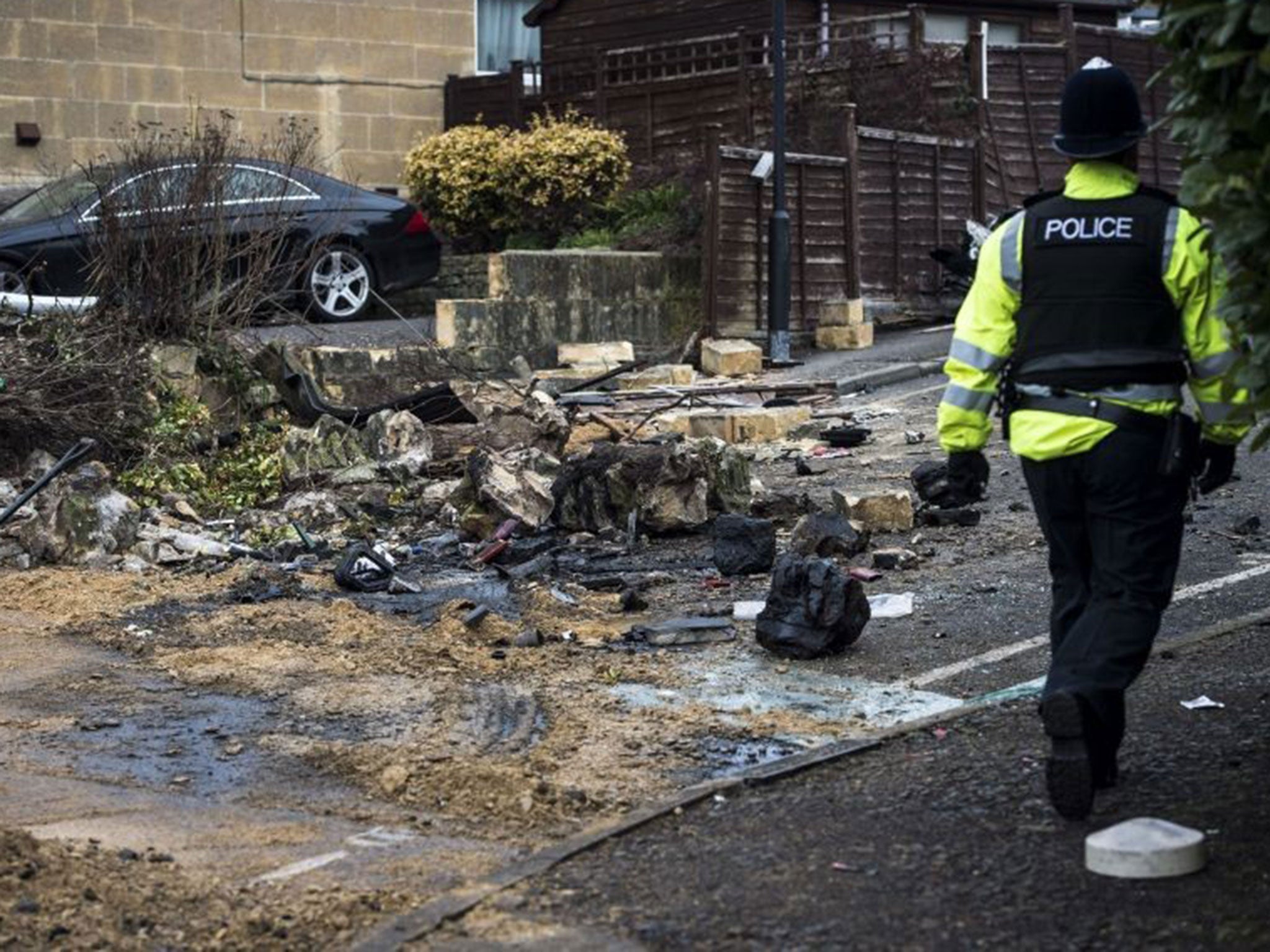 Debris at the crash site on Lansdown Lane, Bath (PA)