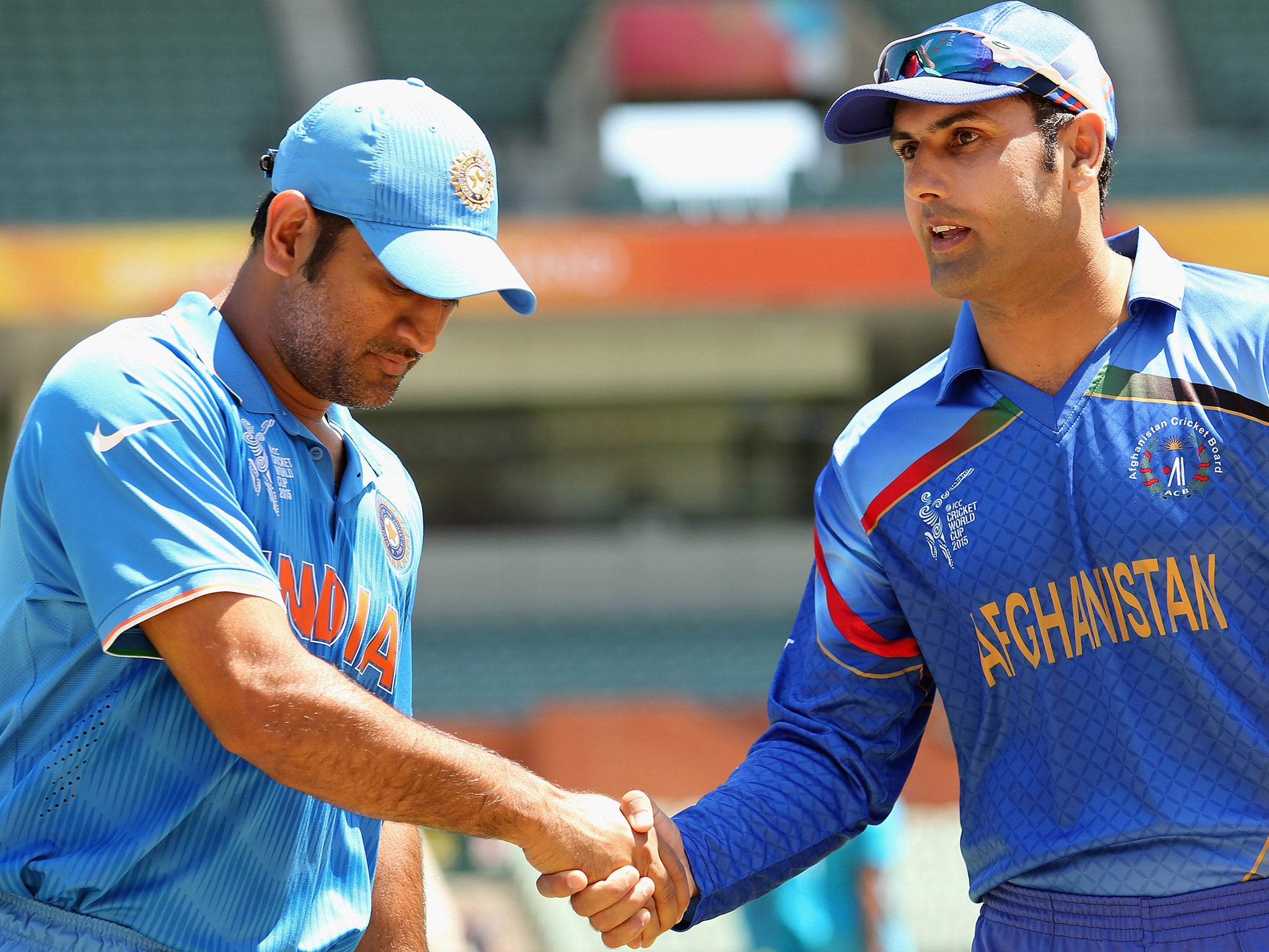 Afghanistan captain Mohammad Nabi shakes hands with India's M S Dhoni prior to a World Cup warm up match in Adelaide last week (Getty)