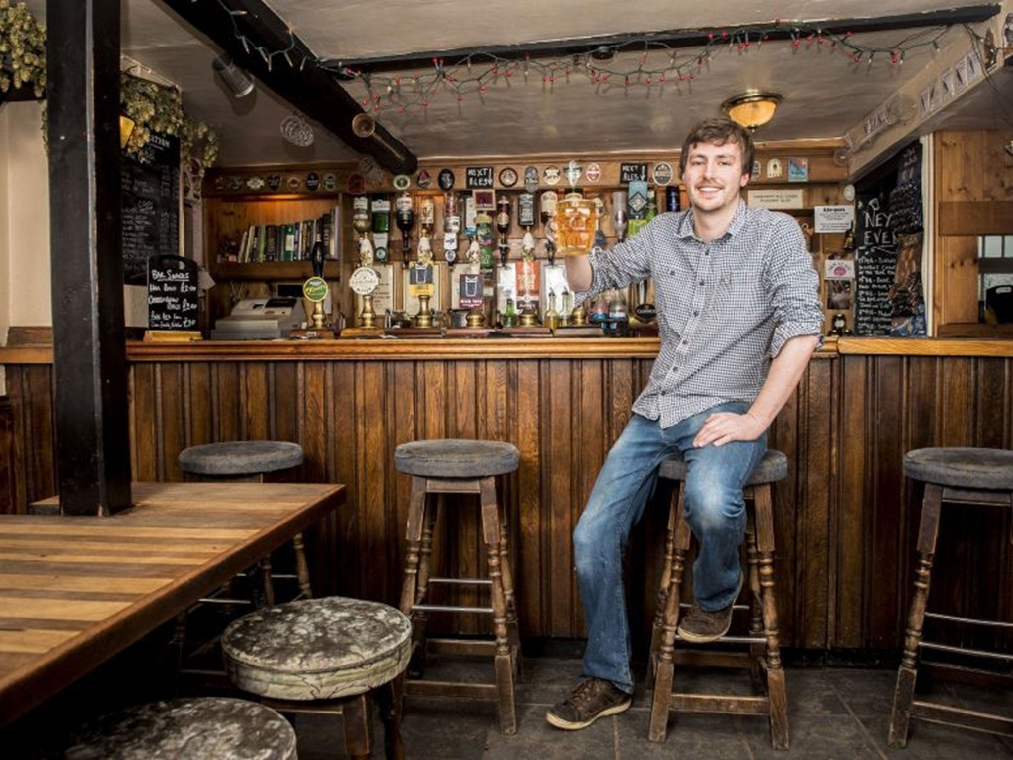 Landlord of the Salutation Inn Peter Tiley at the bar at the Campaign for Real Ale (Camra) Pub of the Year, in the rural village of Ham, Gloucestershire.