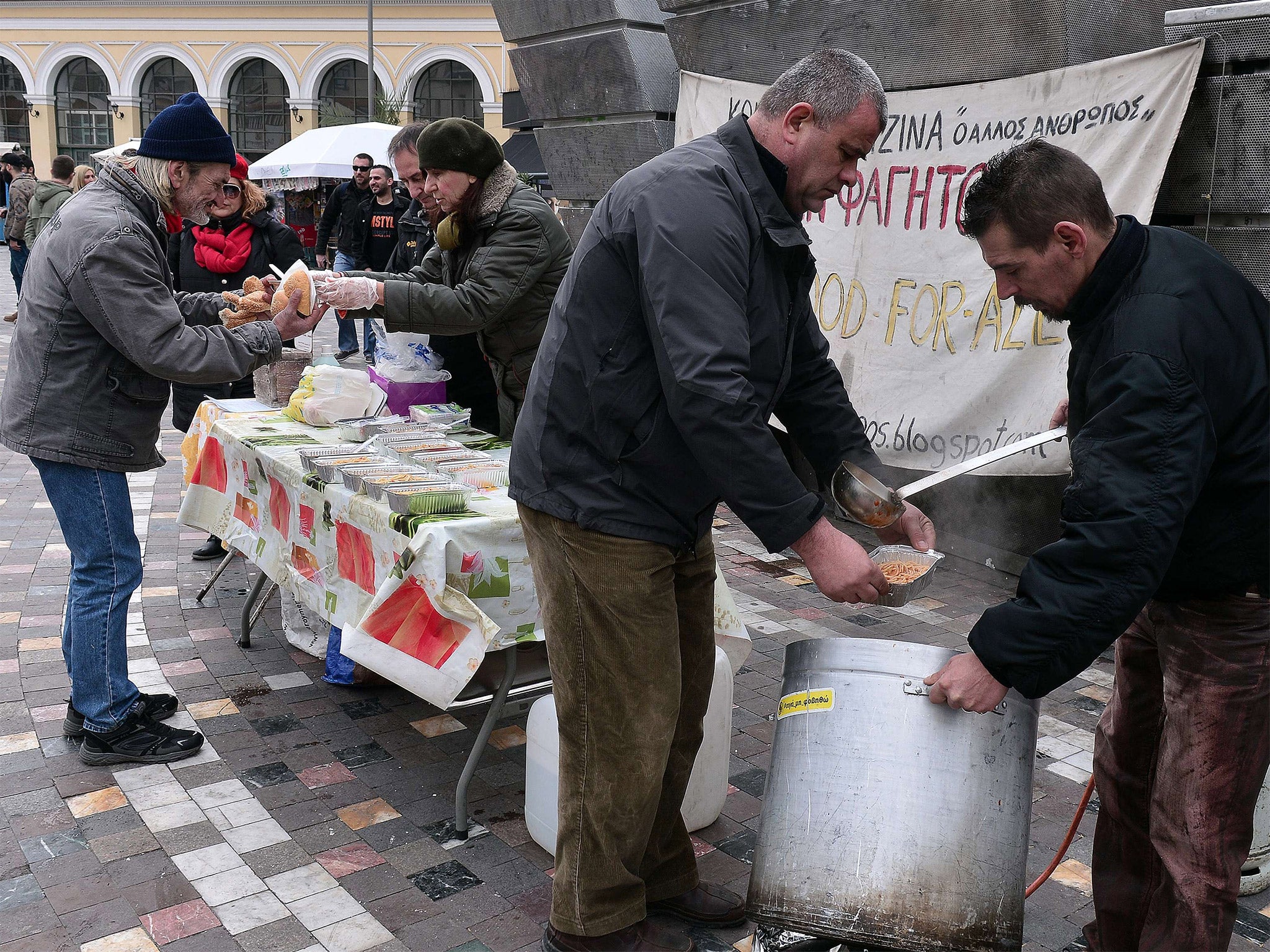 Free meals are served in Athens as Greeks cling to hope of a bailout deal