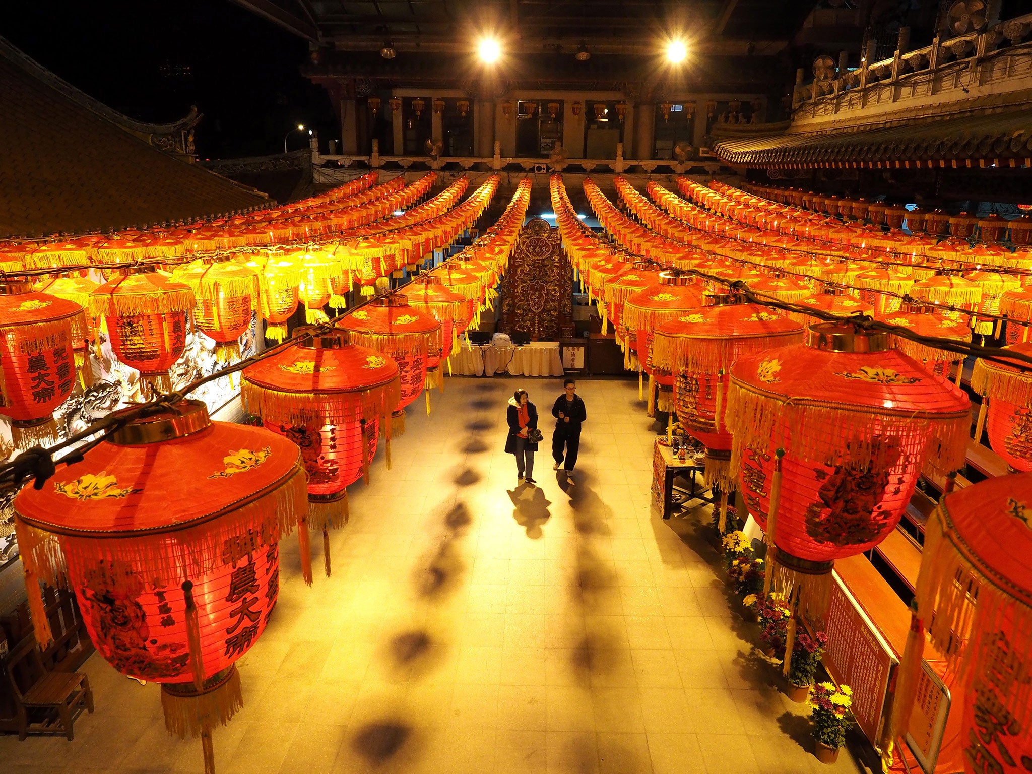 A young couple visit theTaoist temple Hsian Seh Gong in Sanchung, New Taipei City, Taiwan