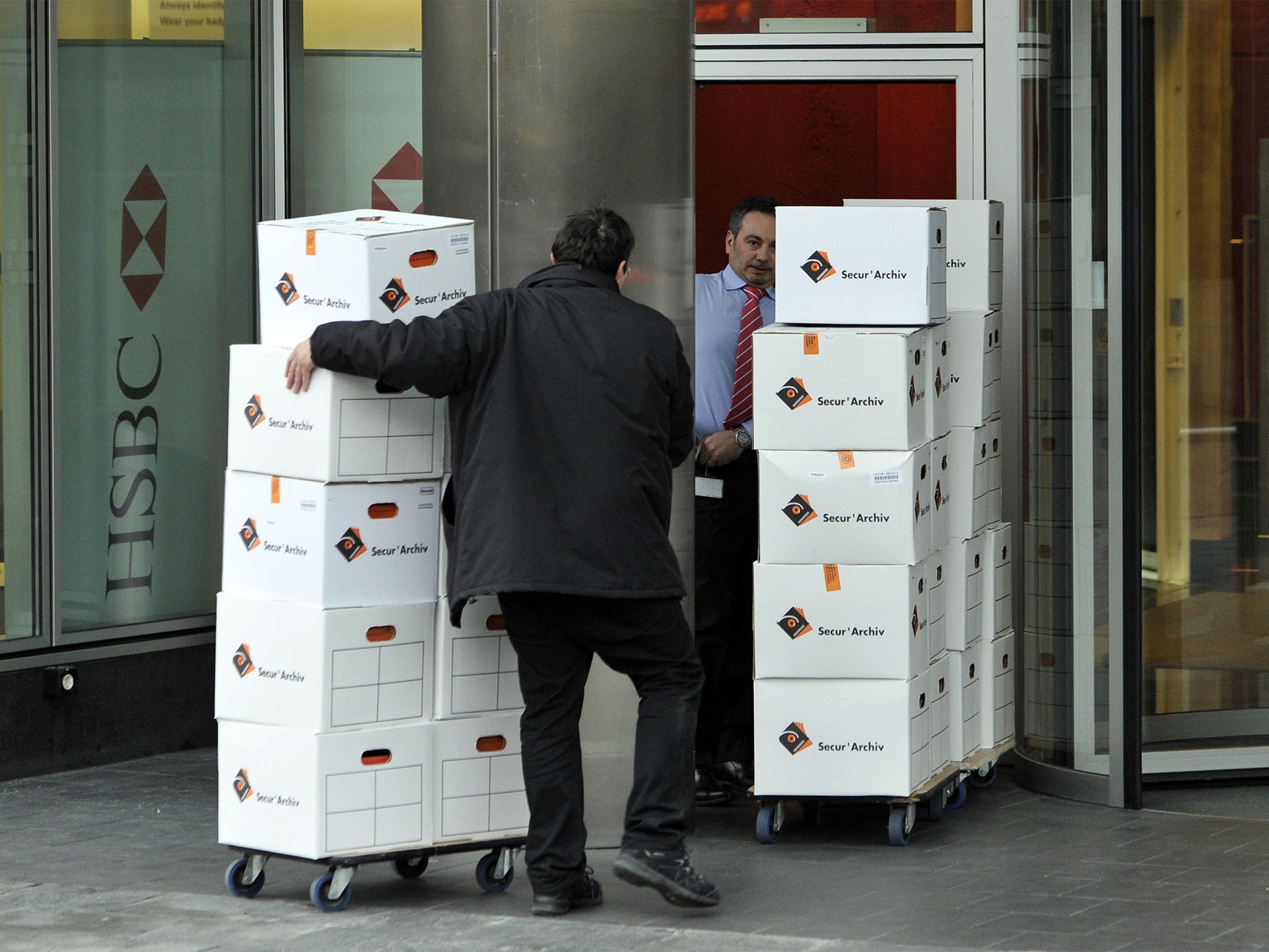 Archives are returned to HSBC premises in Geneva, on the request of Attorney General Olivier Jornot, who oversaw Wednesday's surprise search of the bank (Getty)