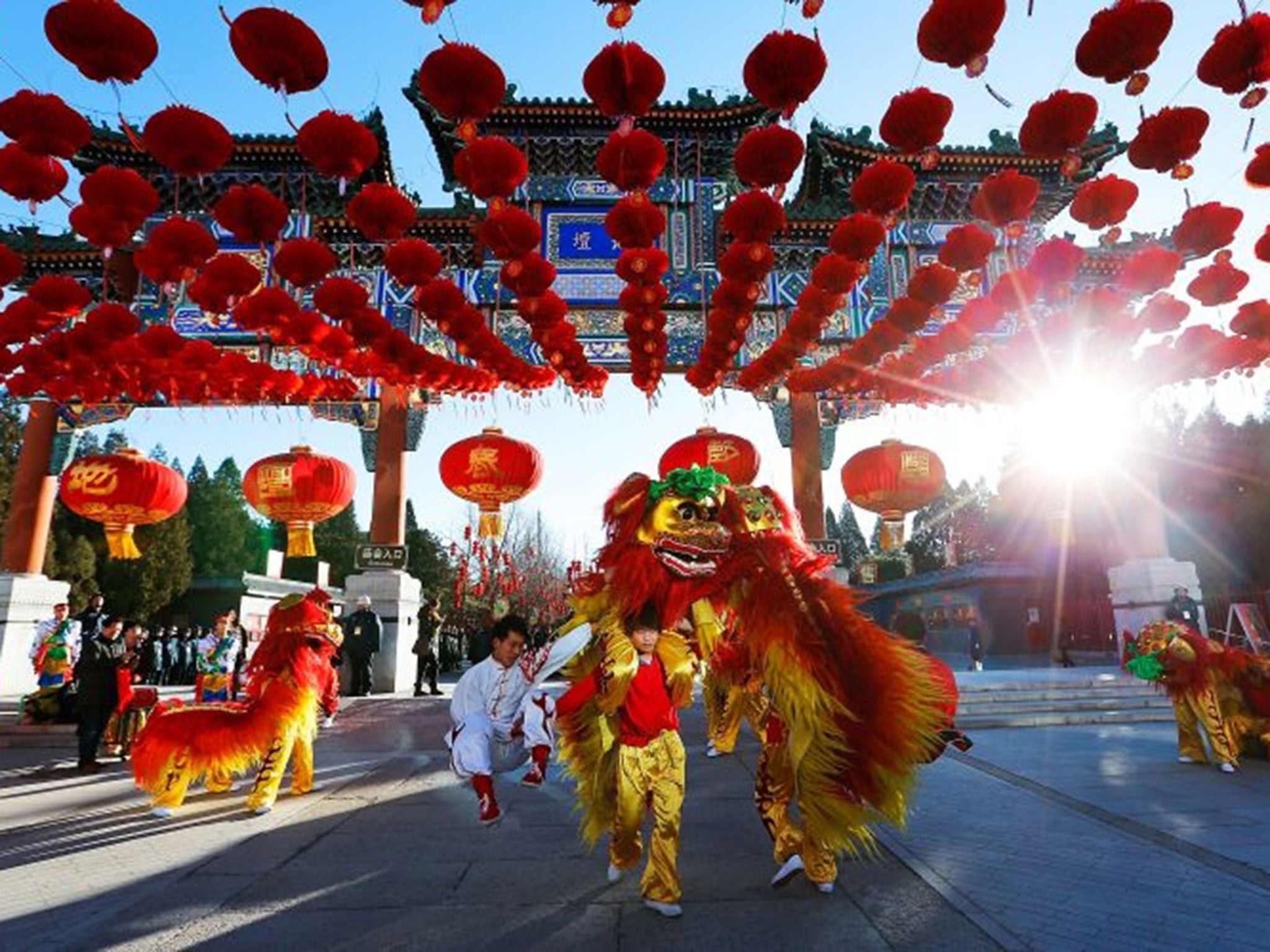 Chinese folk artists perform during the opening ceremony of the Spring Festival Temple Fair at the Temple of Earth in Beijing, China.