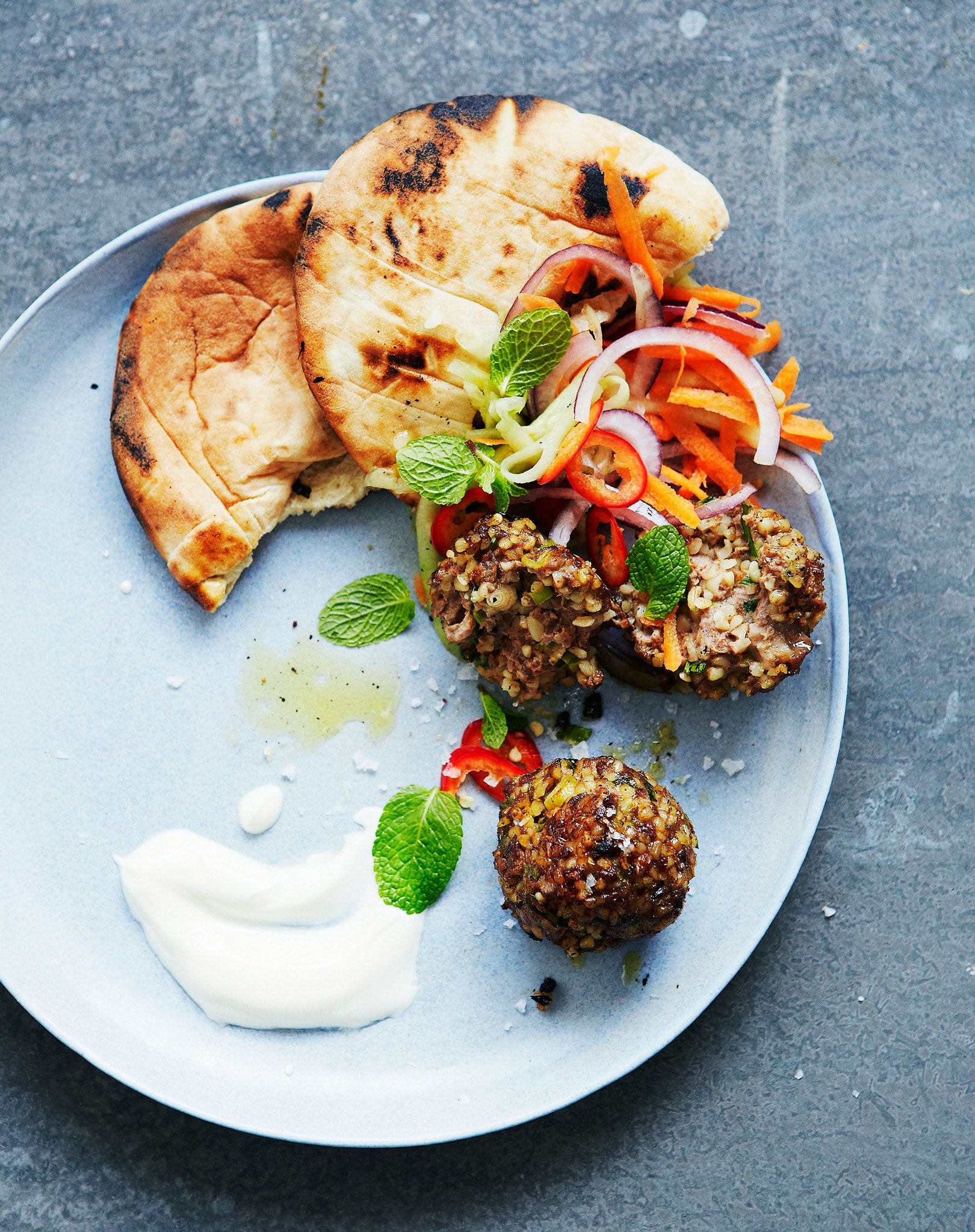 Serve Bill's spiced lamb meatballs with salad, yoghurt and flatbreads