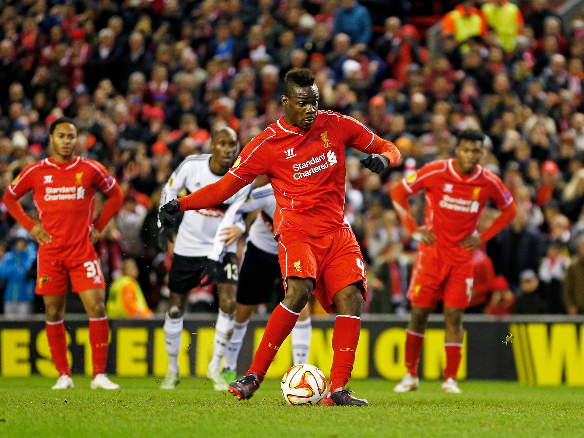 Mario Balotelli slots home the winning penalty