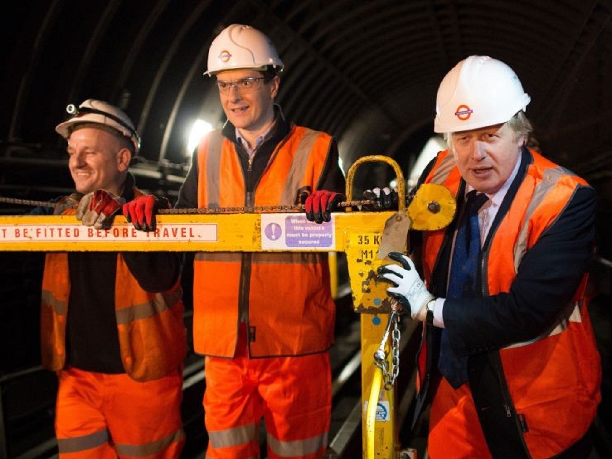 The politicians observe track-workers maintaining the Tube system