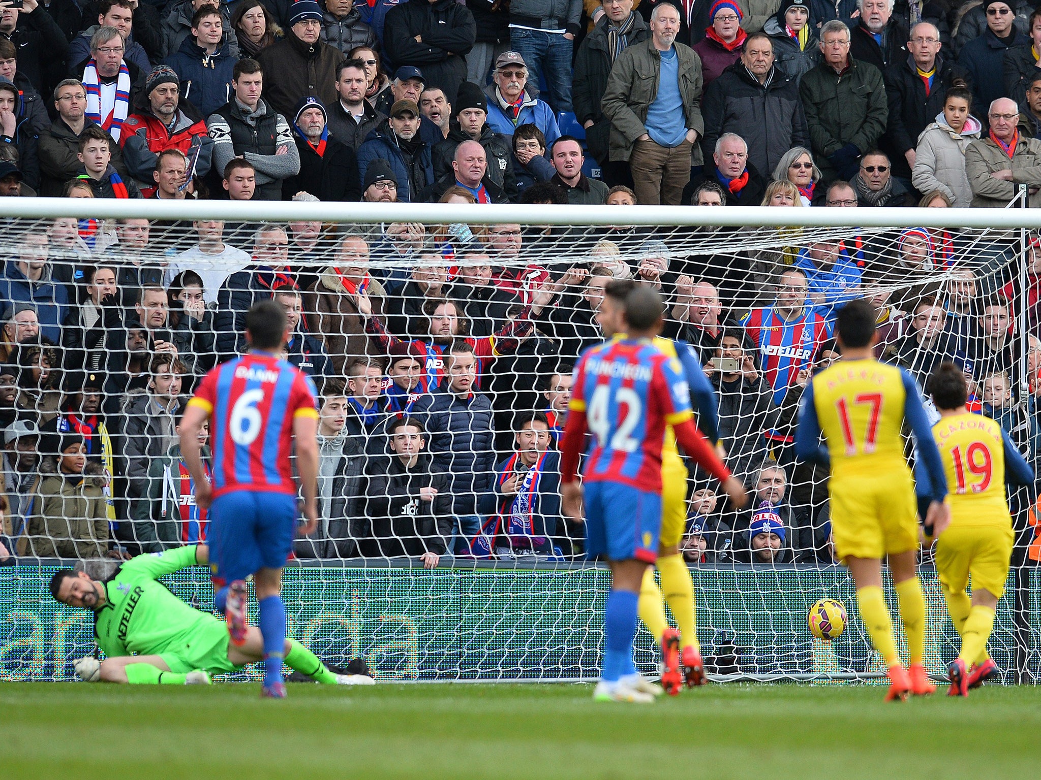 Santi Cazorla strokes home an early penalty after Welbeck was brought down