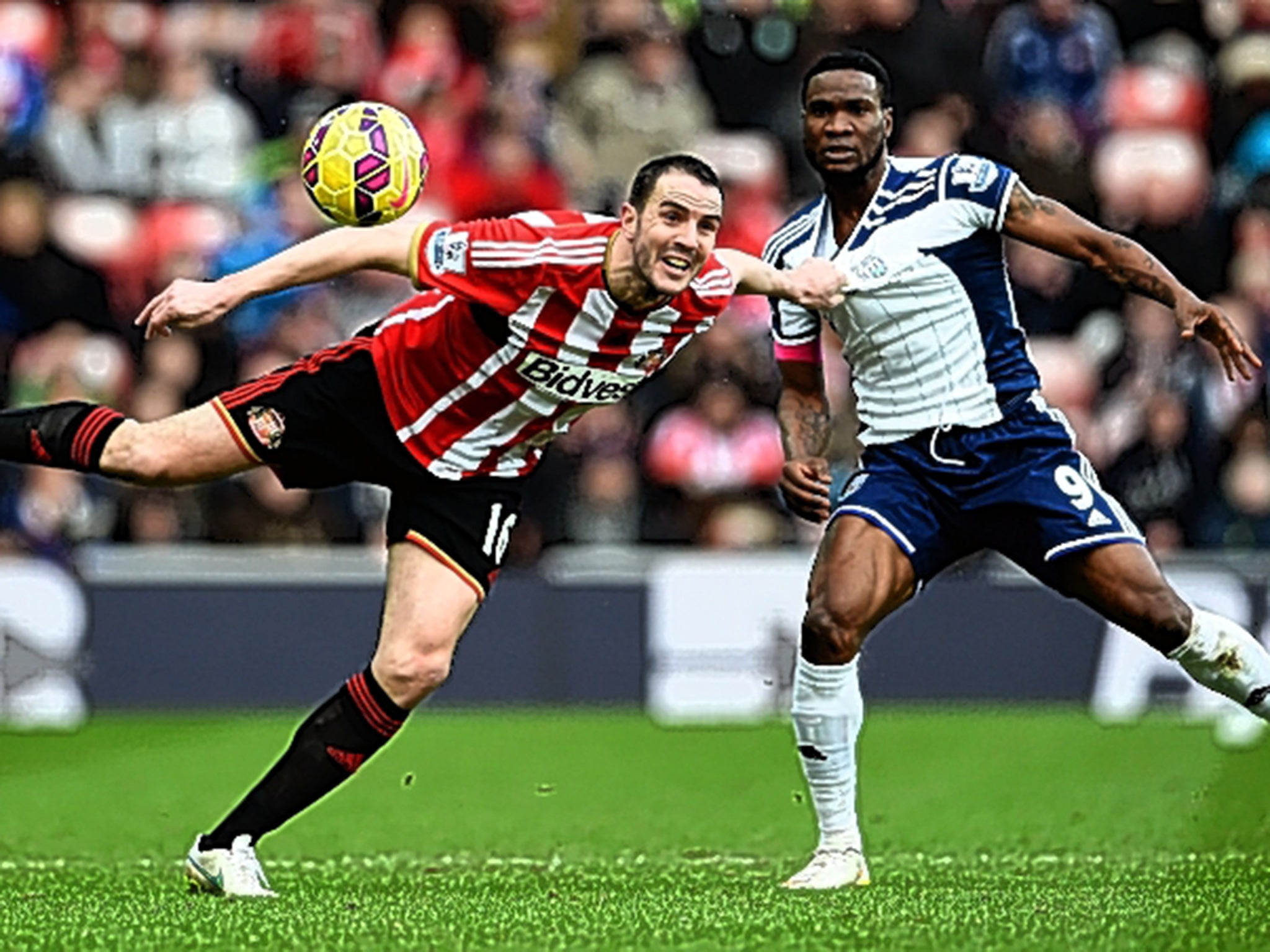 John O'Shea wins a header in front of Brown Ideye