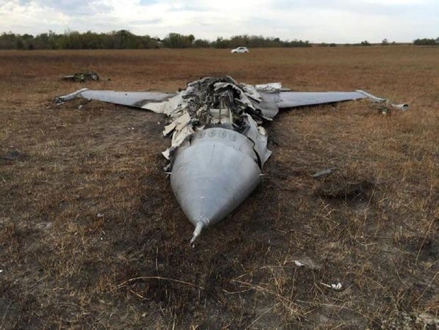 The instructor managed to eject before his plane crashed in a field.