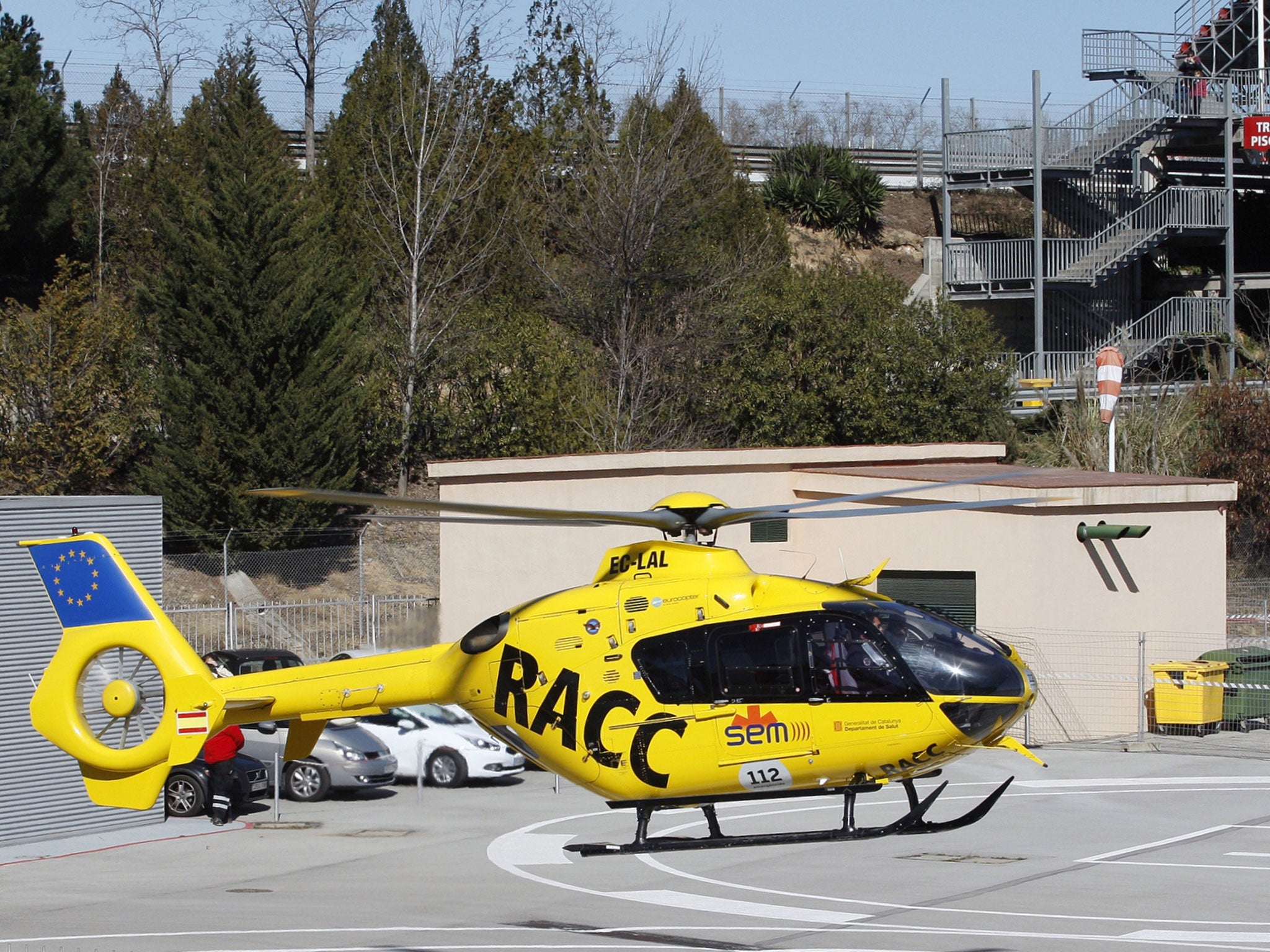 The helicopter transporting Fernando Alonso lifts-off