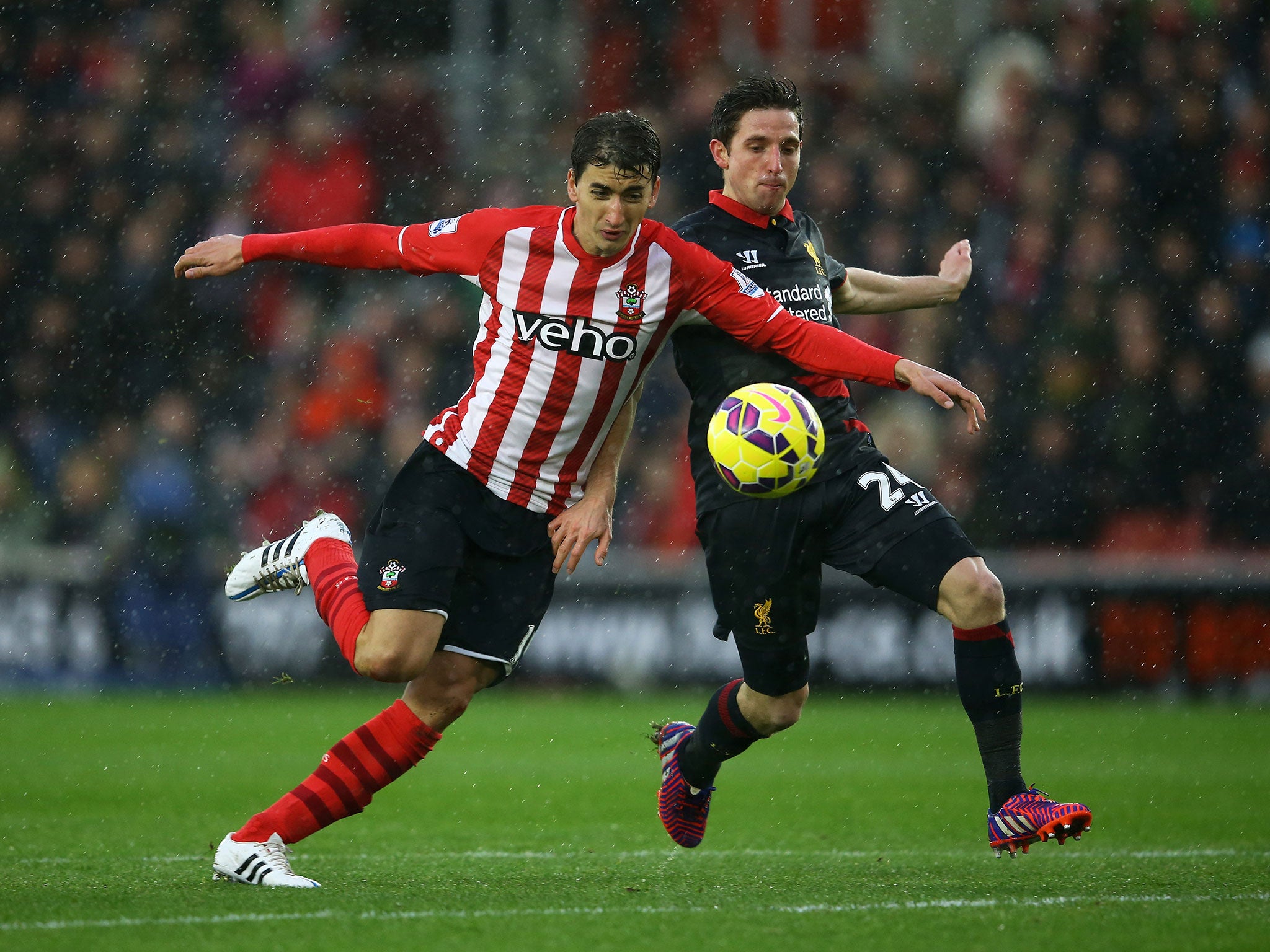 Joe Allen tries to win back possession