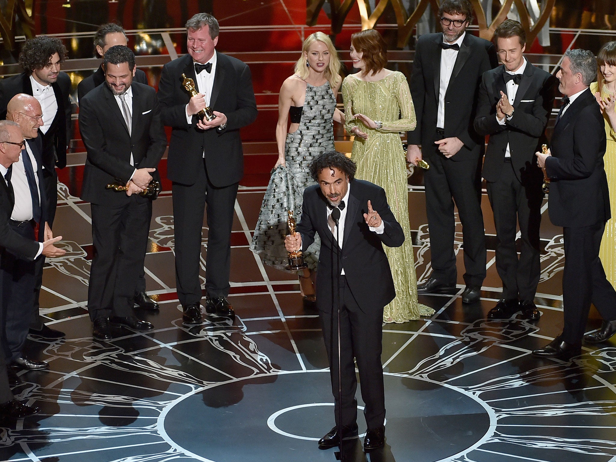 The cast and crew of Birdman accept their Best Picture Oscar on stage