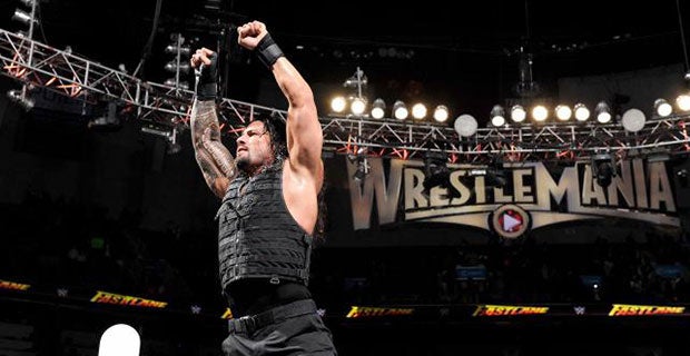 Roman Reigns celebrates his victory