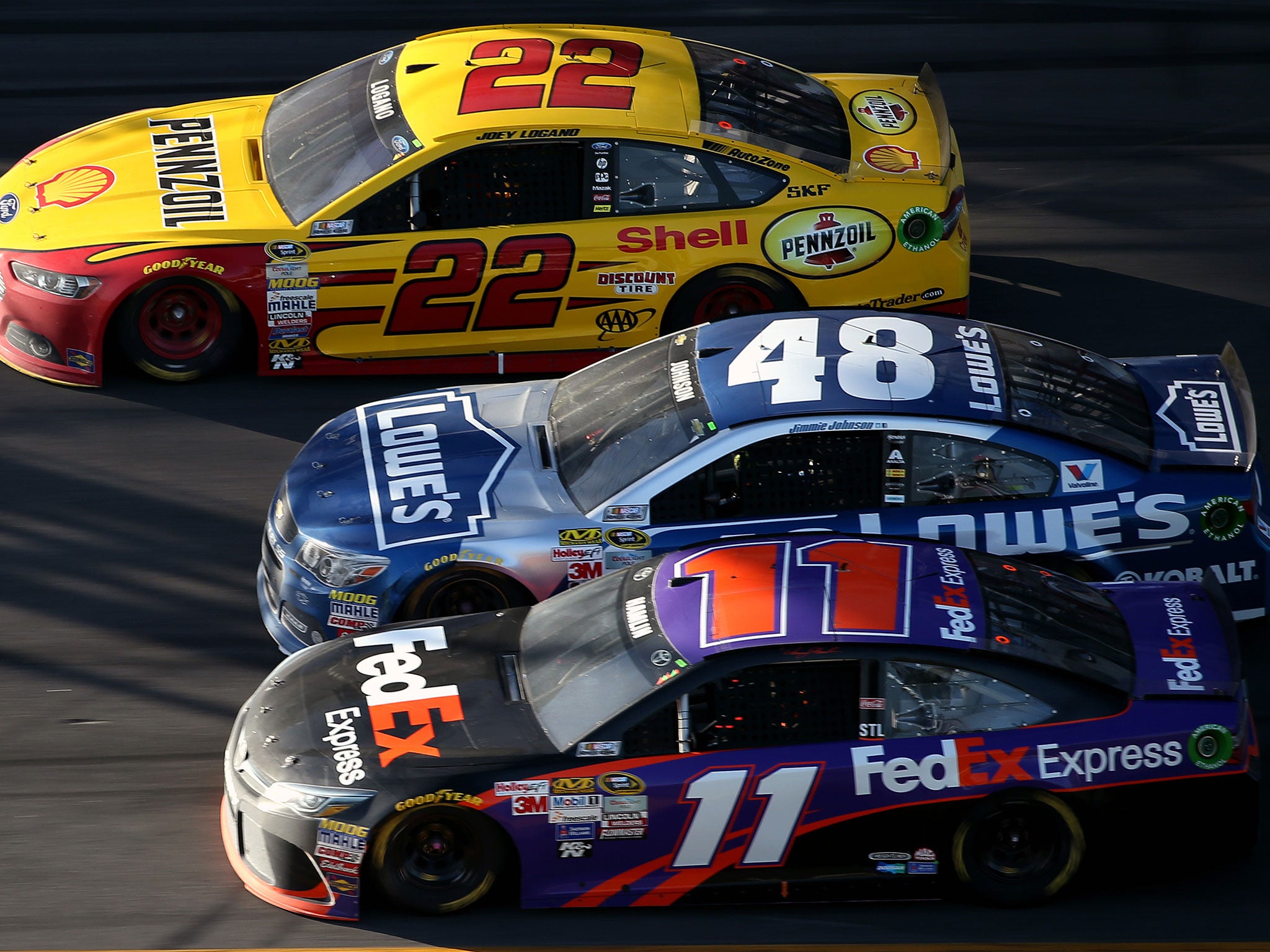 Joey Logano, Jimmie Johnson and Denny Hamlin run three-wide