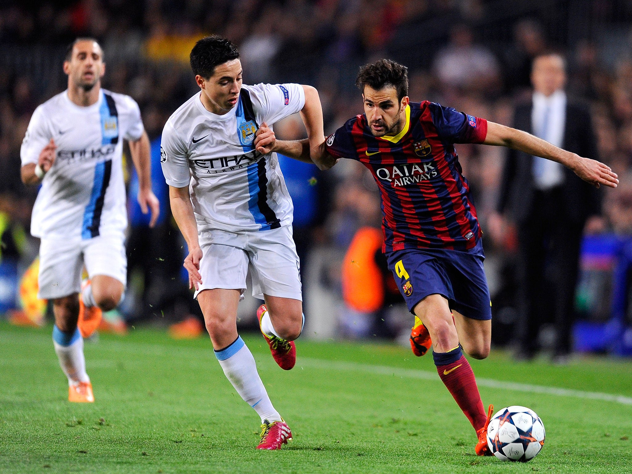 Nasri challenges Fabregas during last season's round of 16 clash