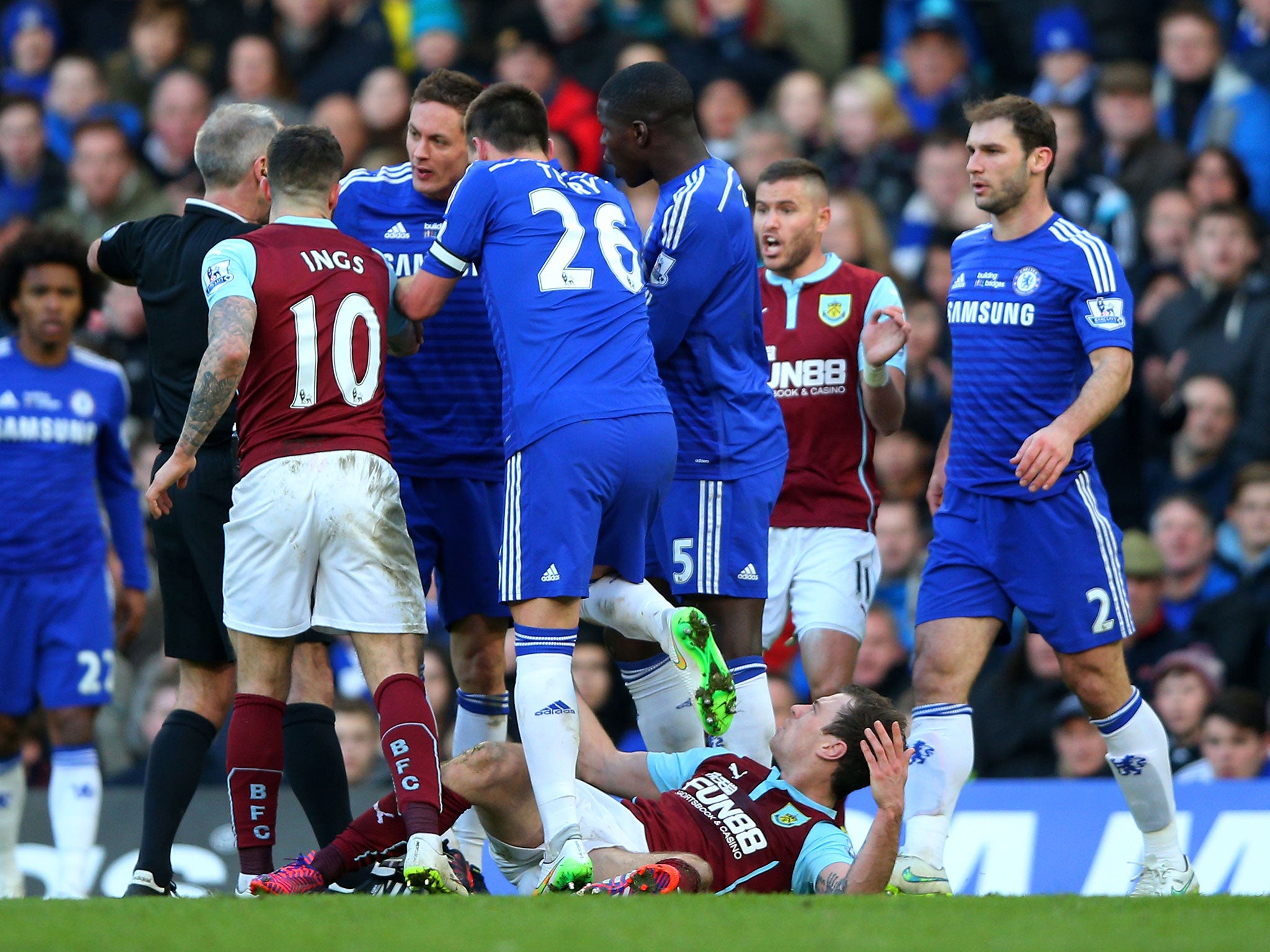 Nemanja Matic confronts referee Martin Atkinson