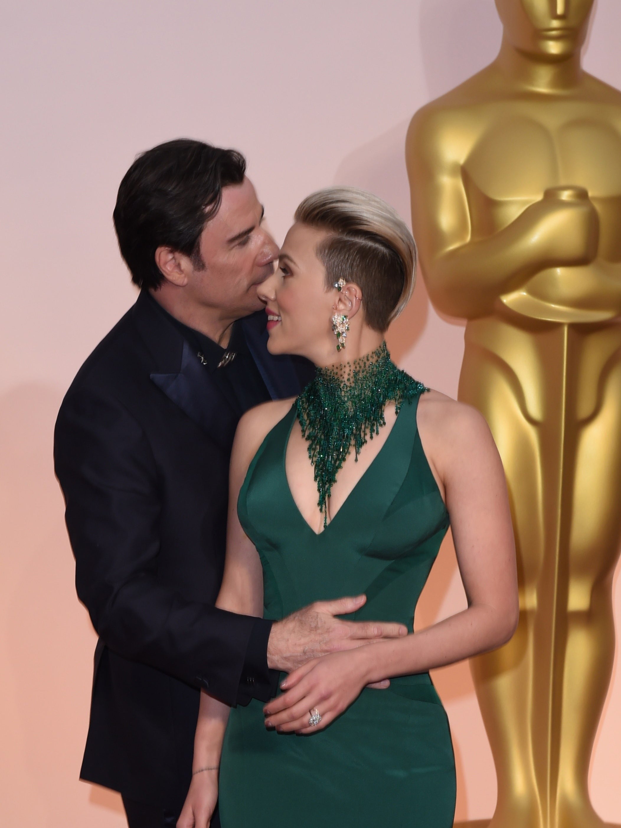 Change in perspective: Travolta and Johnasson interact after the uncomfortable kissing photograph was taken