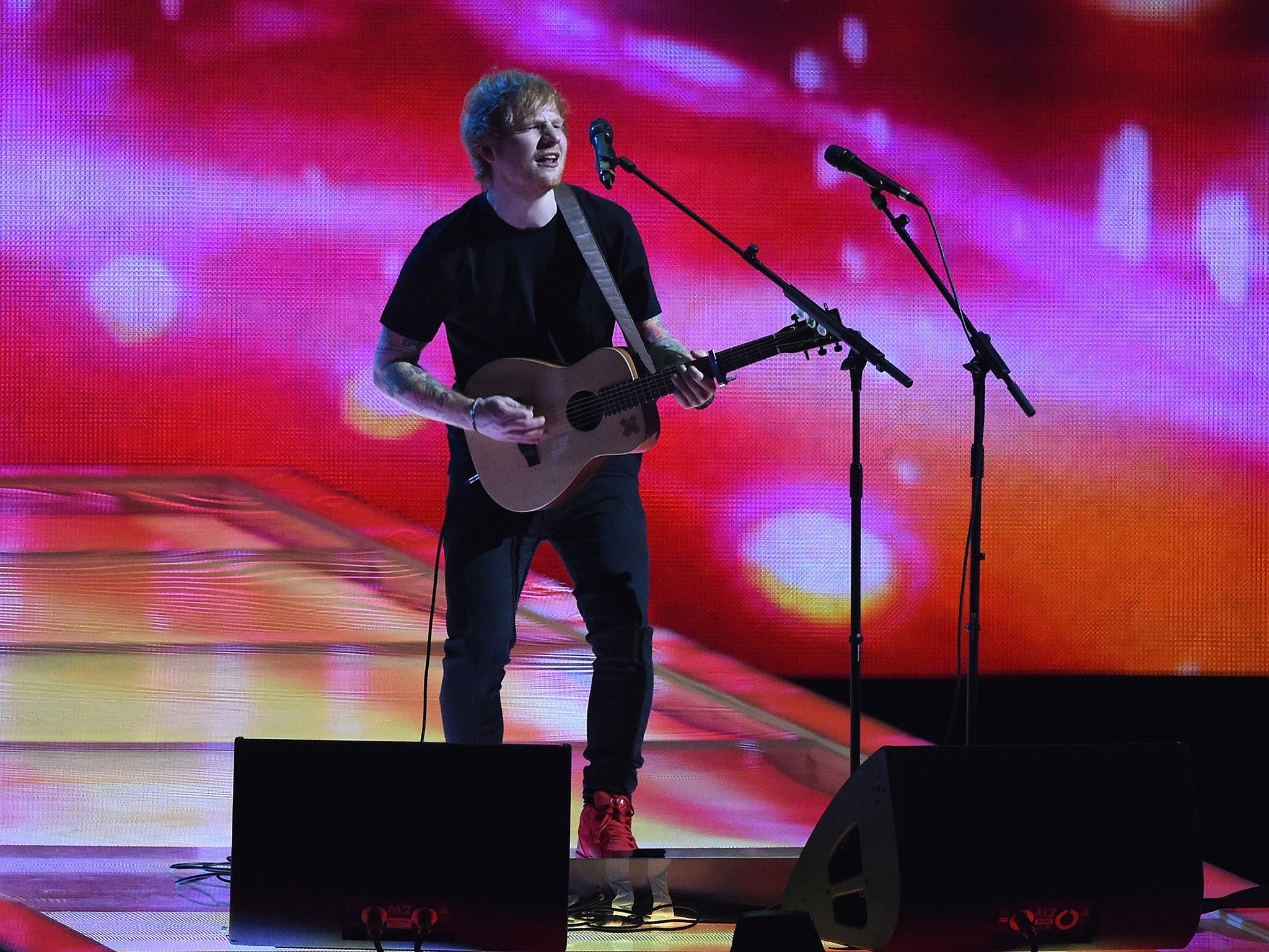 Ed Sheeran performs on the Brits stage (Getty)