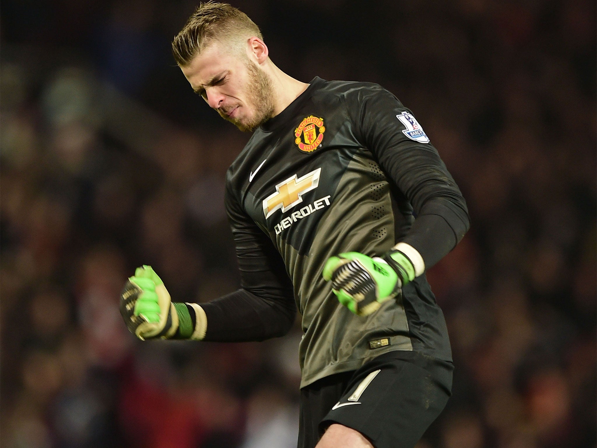 David De Gea punches the air after Wayne Rooney's opener