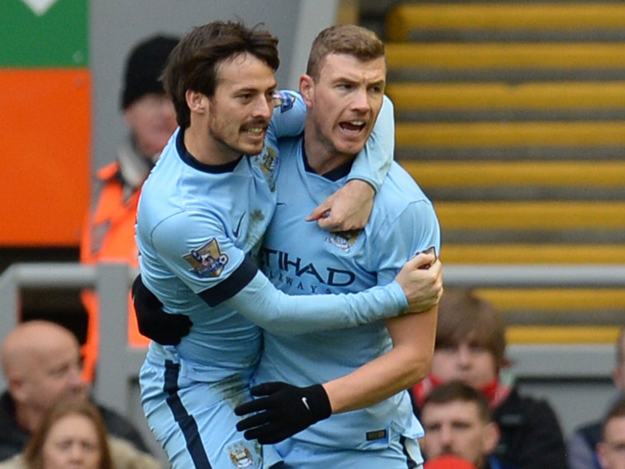 Edin Dzeko celebrates his goal with David Silva