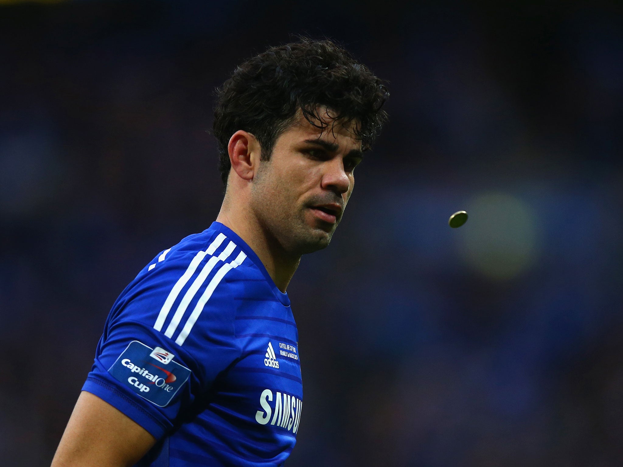 Diego Costa sees a coin being thrown in his direction