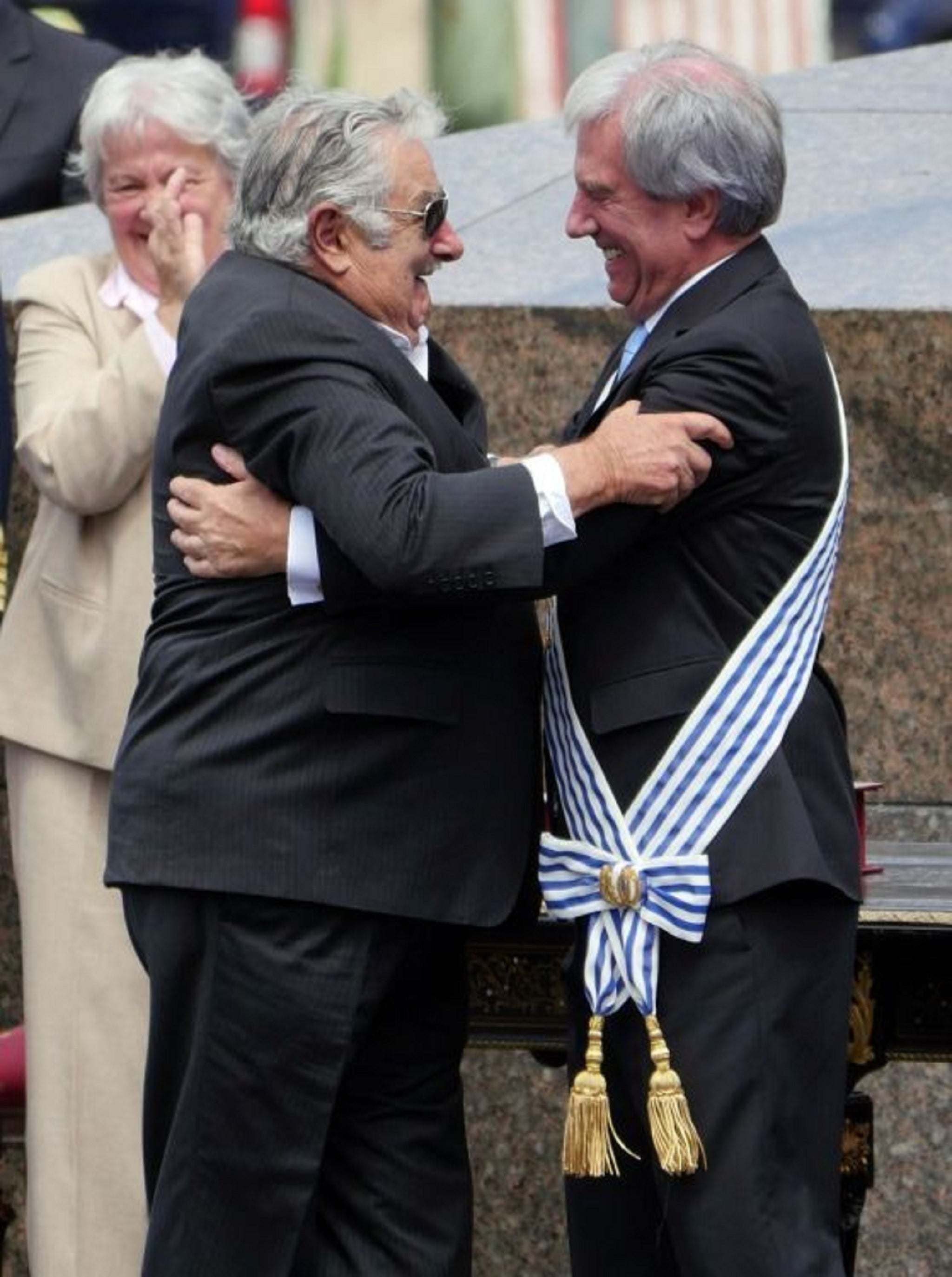 Mujica having passed the presidential sash to Vazquez