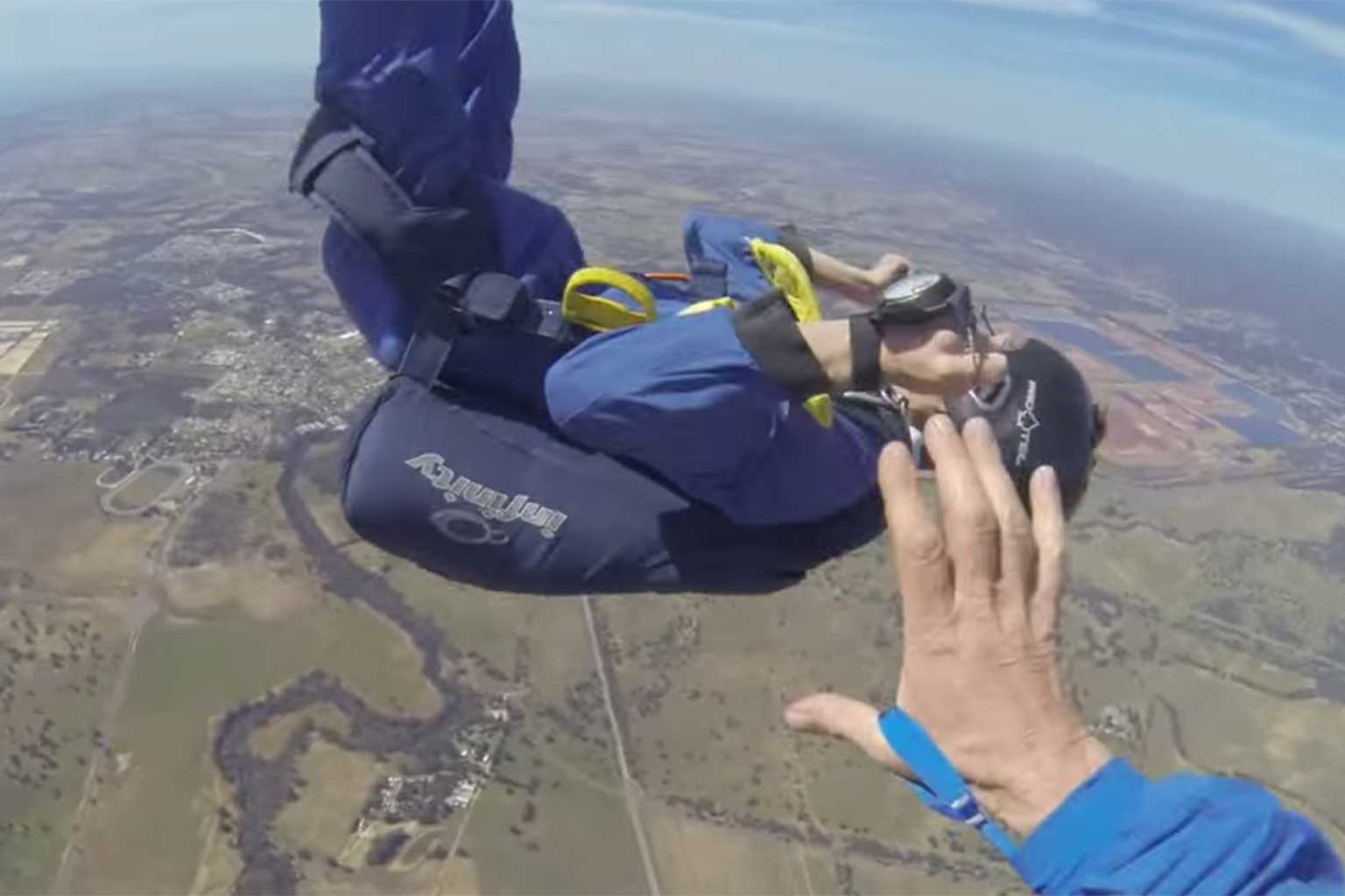 Instructor Sheldon McFarlane reaches for his student