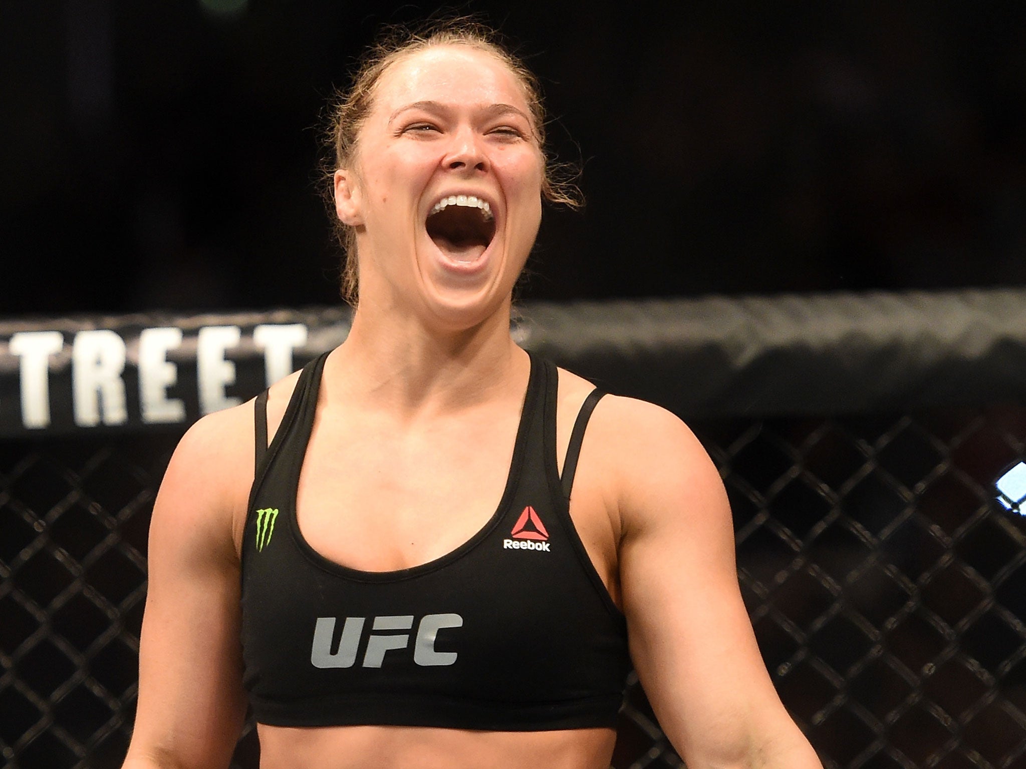 Ronda Rousey celebrates her victory over Cat Zingano at UFC 184