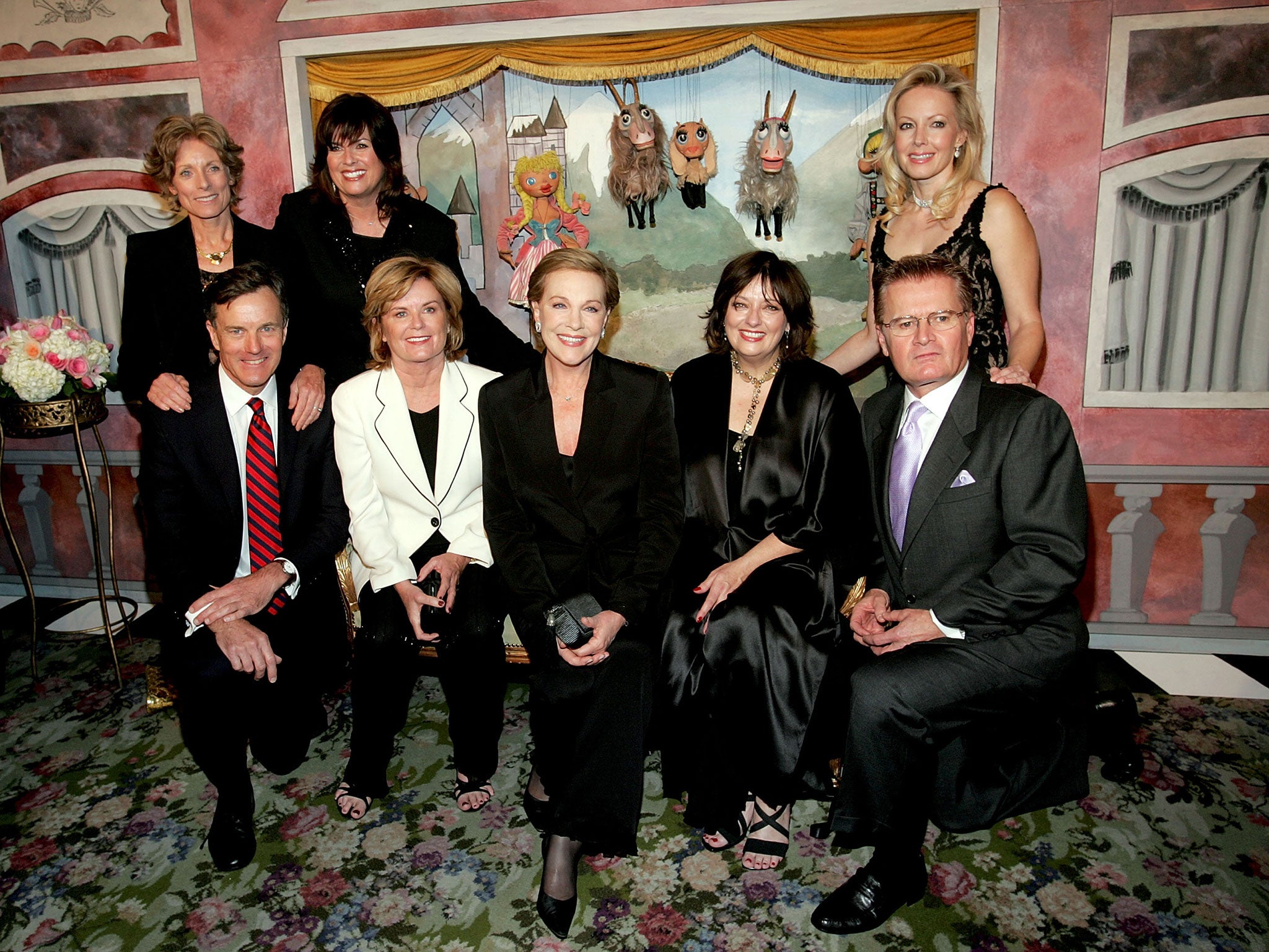 Actress Julie Andrews (C) poses for a photo with the cast from (L-R) Charmain Carr, Debbie Turner and Kym Karath in back row, front row are Nicholas Hammond, Heather Menzies, Andrews, Angela Cartwright and Duane Chase in 2005