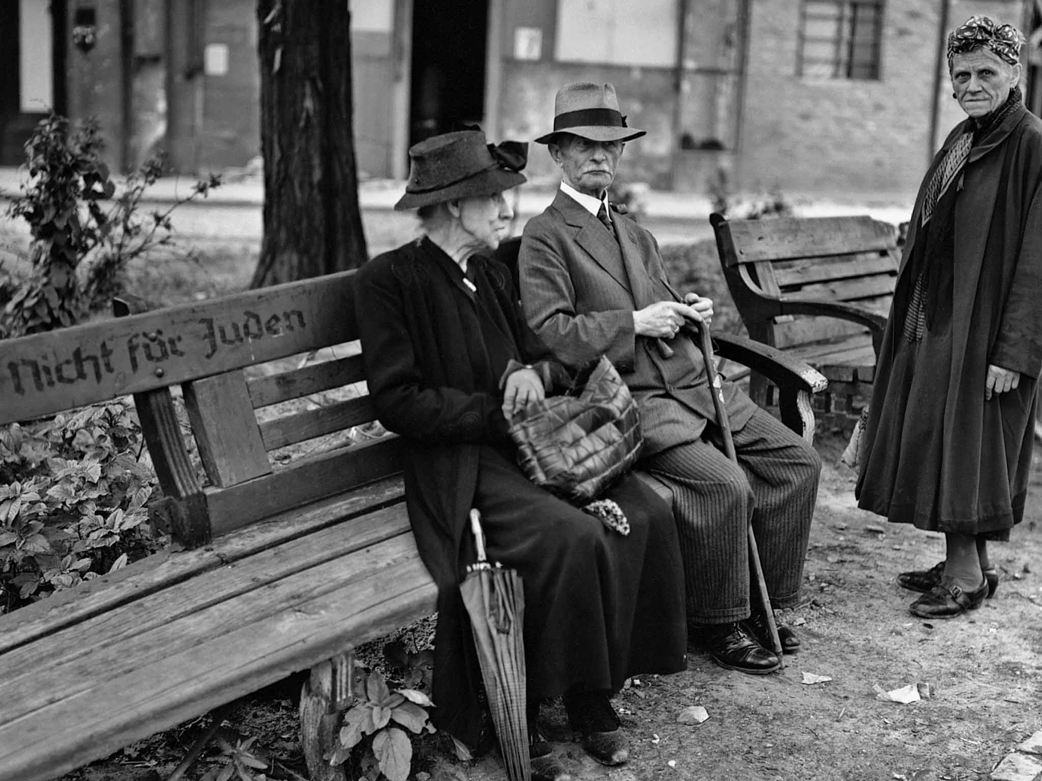 Survival in a hostile world: a park bench in Berlin in 1945 reads 'Nicht fur Juden', Not for Jews