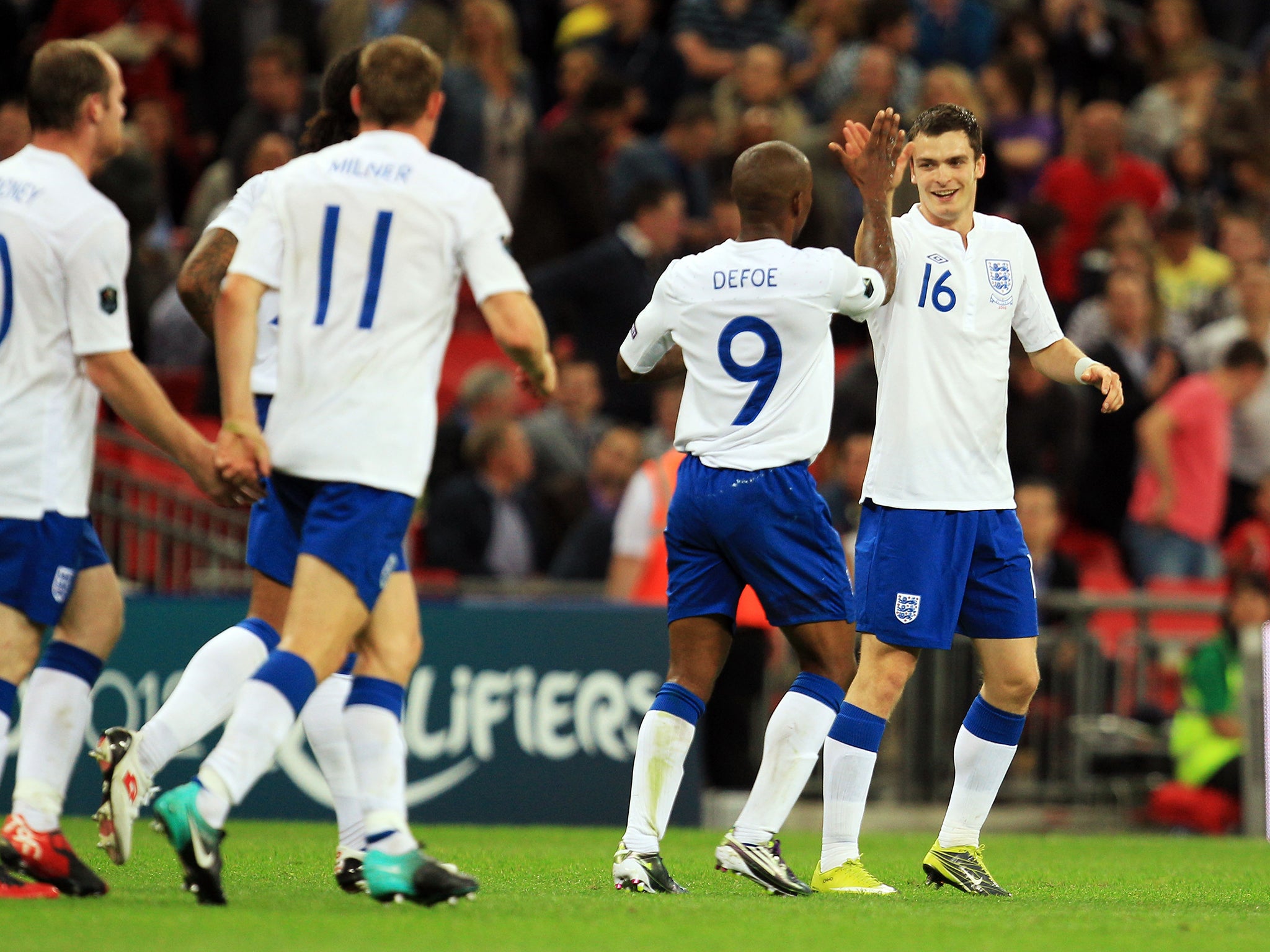 Adam Johnson celebrates scoring for England in 2010