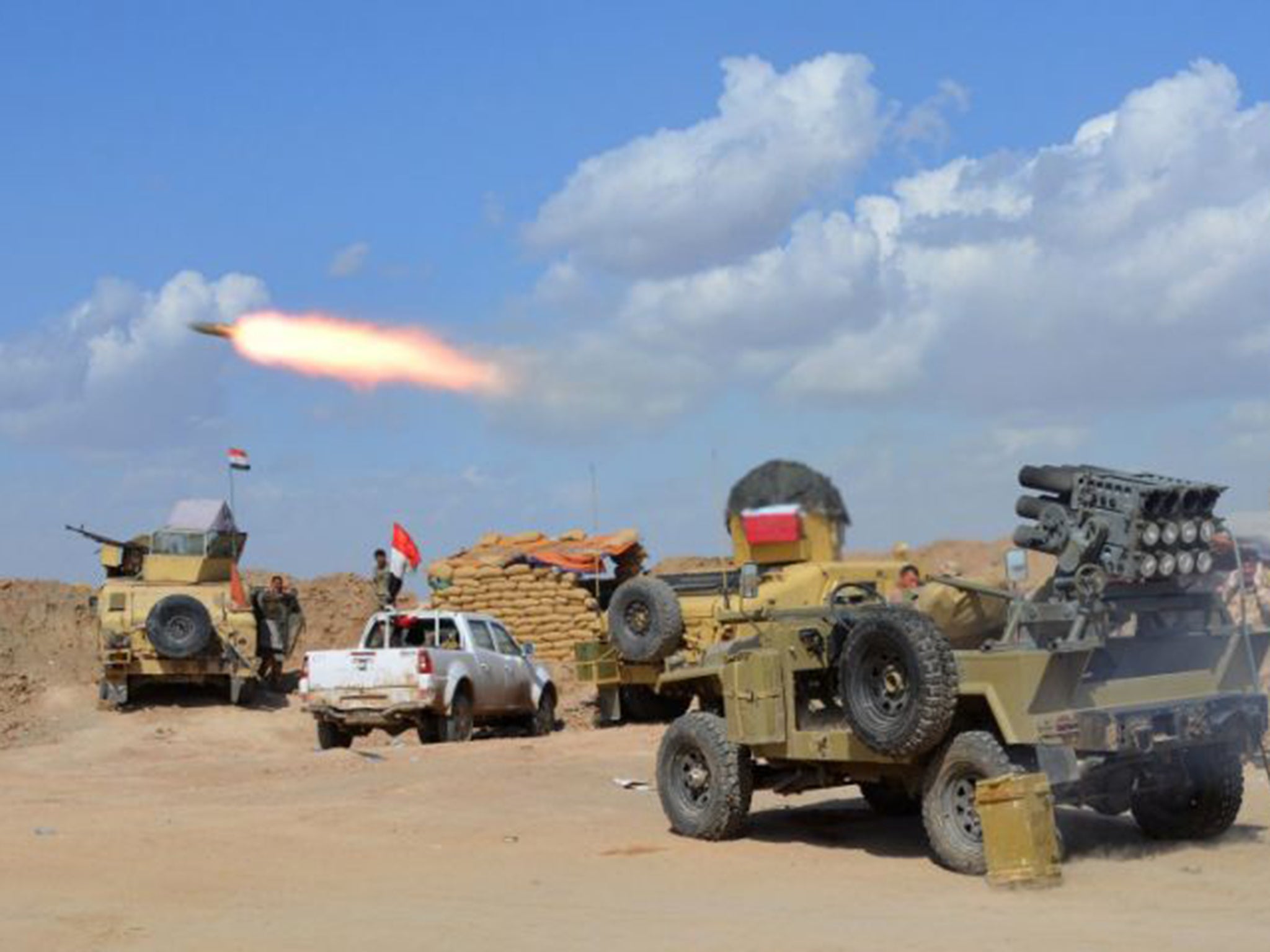 Iraqi government forces and allied militias firing weaponry from a position in the northern part of Diyala