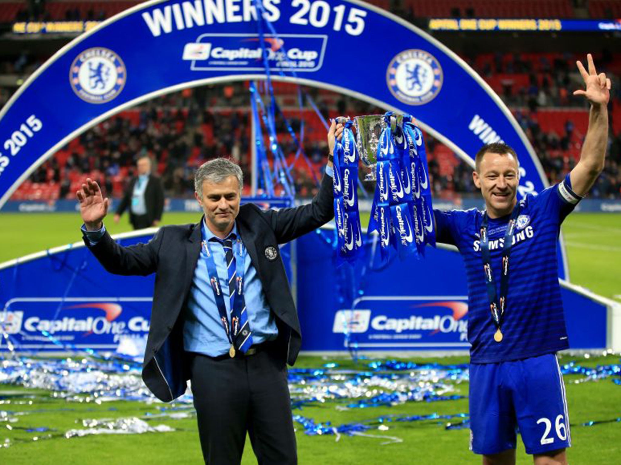 Mourinho (left) and Terry celebrate winning the Capital One Cup