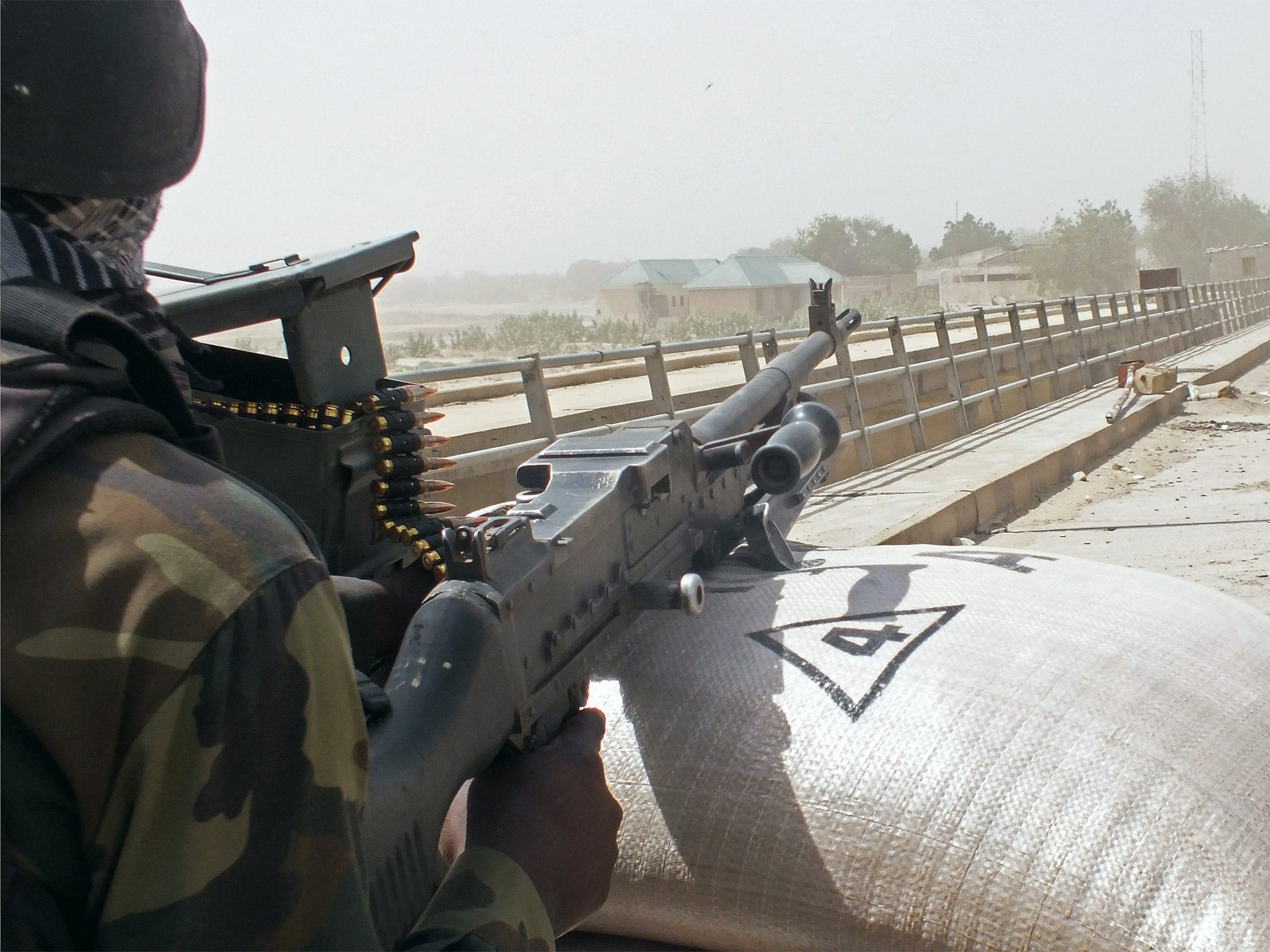 Cameroon soldiers stand guard at a lookout post as they take part in operations against the Islamic extremists group Boko Haram, near the village of Fotokol, Cameroon