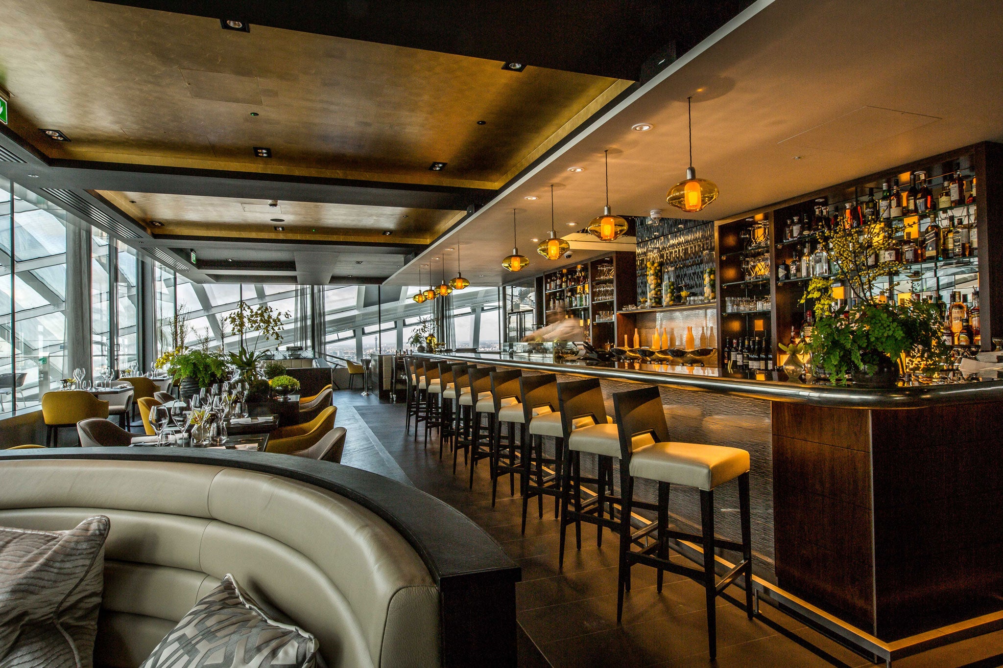 The dining room is pristine, in a posh hotel-ish way, spiffed up in luxe shades of black, brown and gold