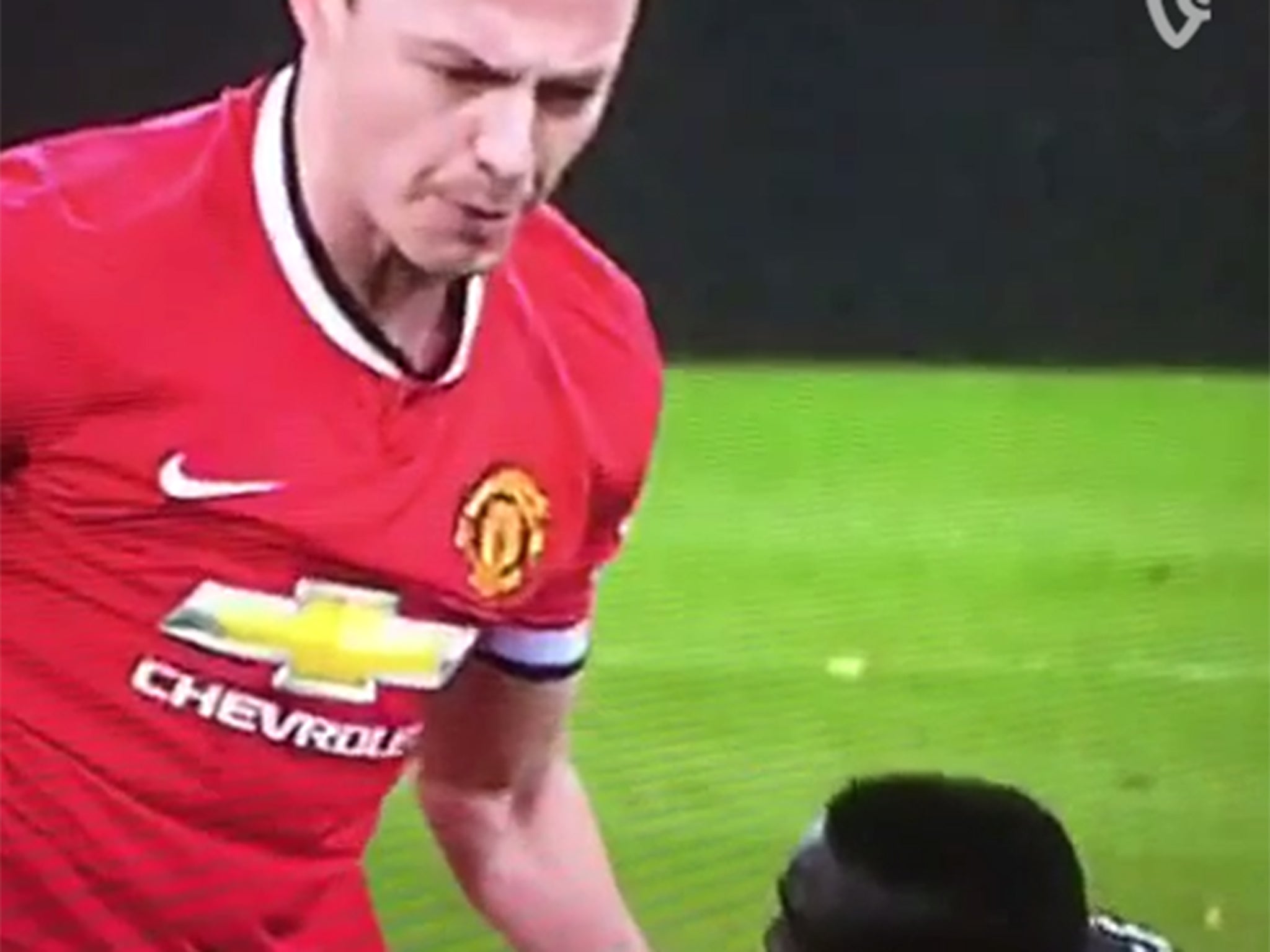 Evans appears to spit at Cisse