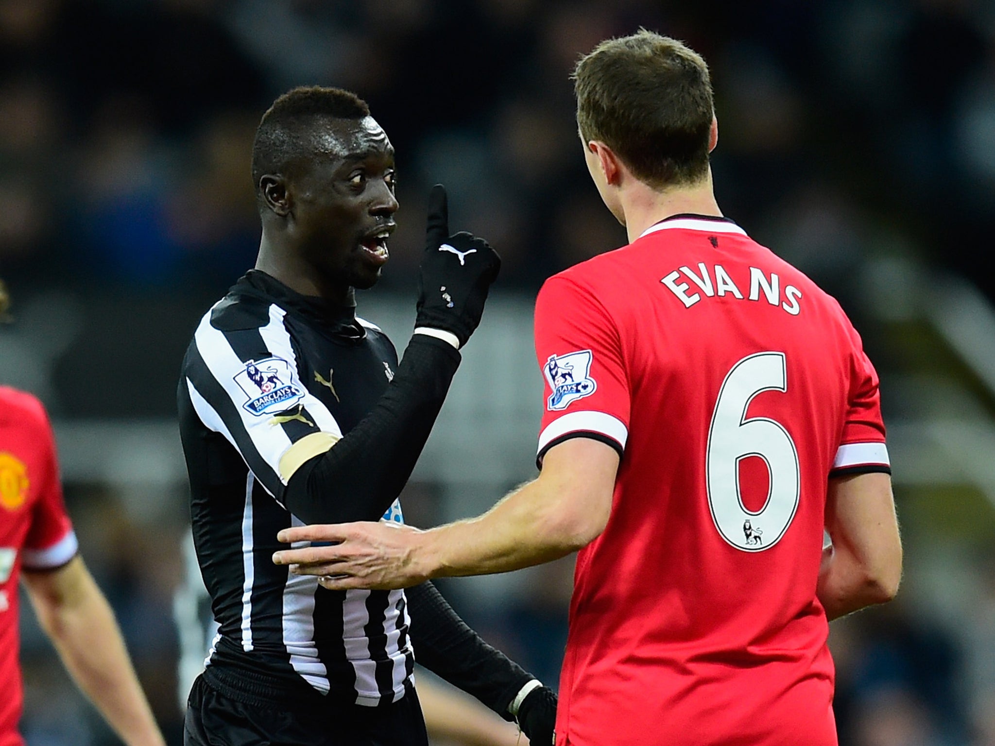 Jonny Evans and Papiss Cisse come together