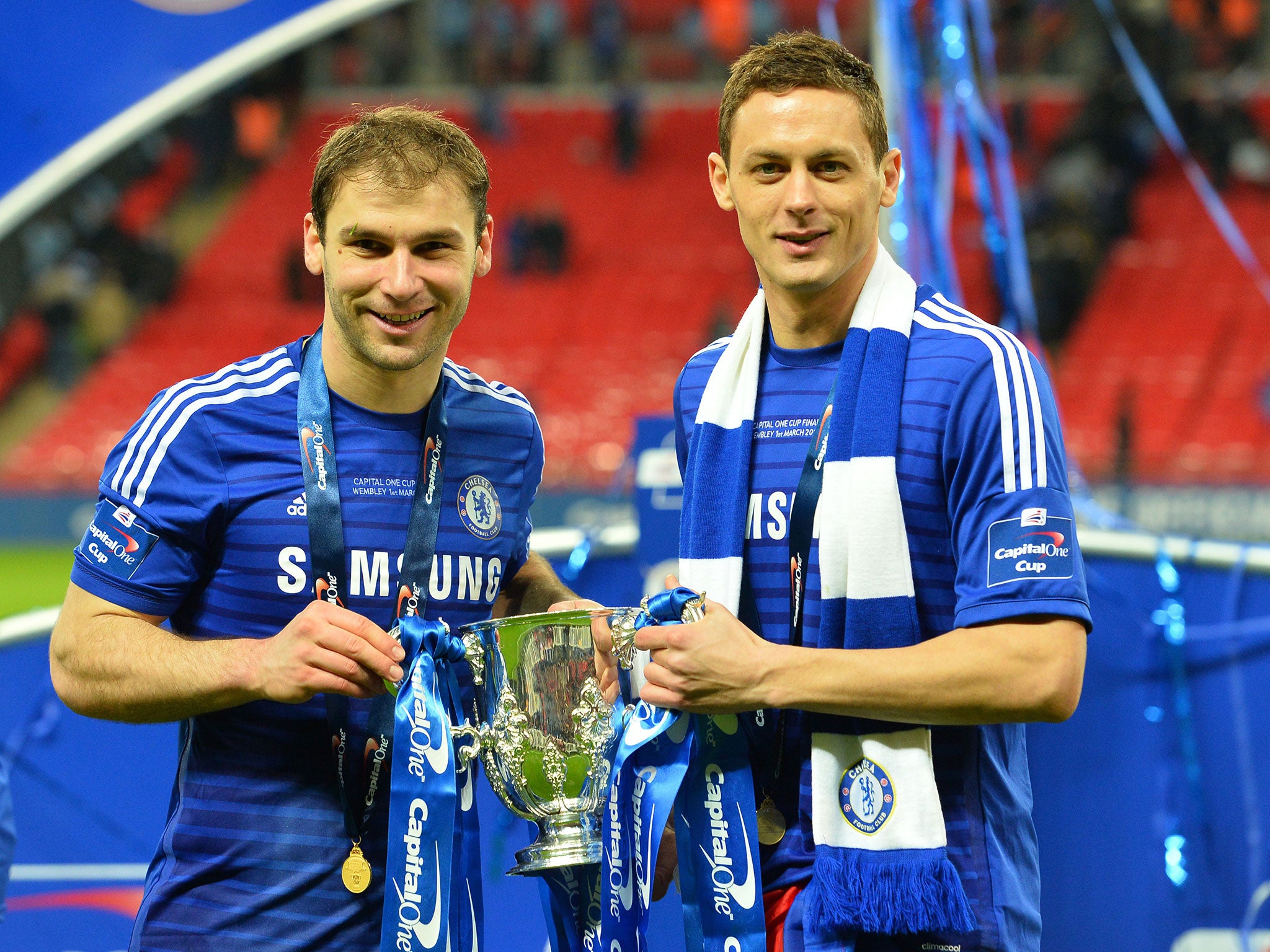 Nemanja Matic holds the Capital One Cup with Branislav Ivanovic