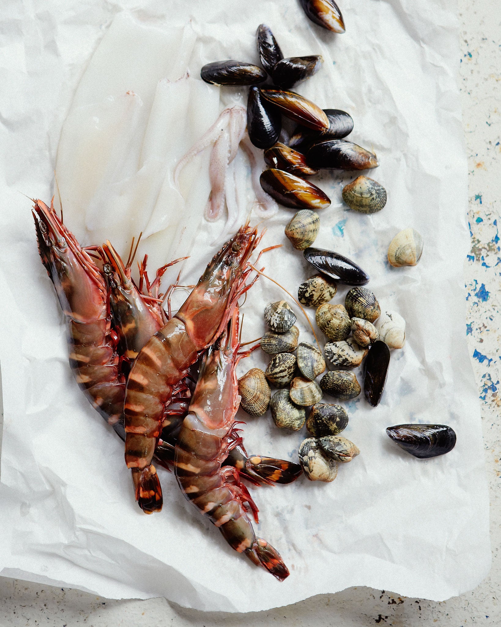 Ingredients for Bill's fideua, including king prawns, mussels and clams