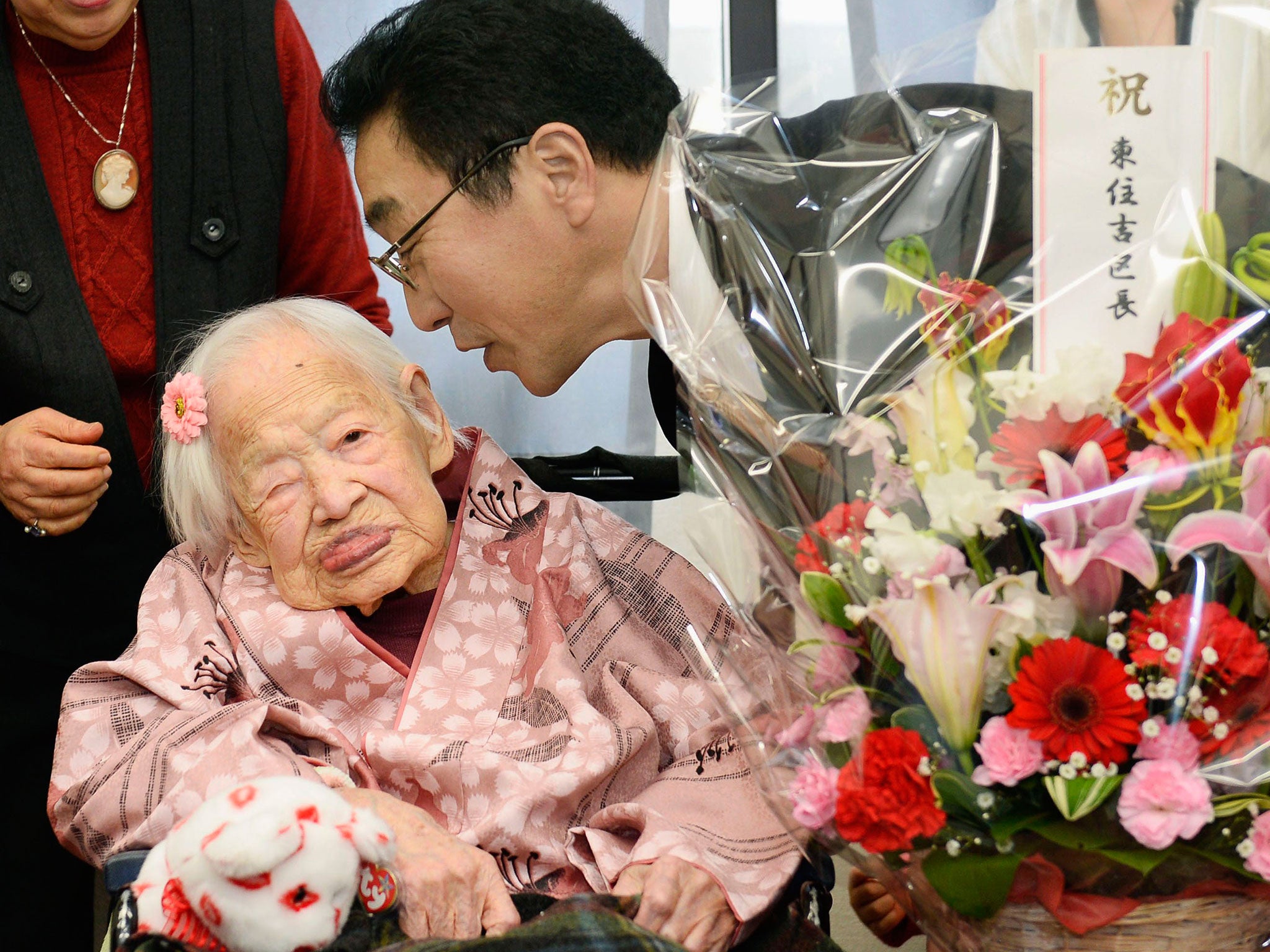 Misao Okawaw with Takehiro Ogura (R), mayor of Osaka's Higashi-Sumiyoshi Ward