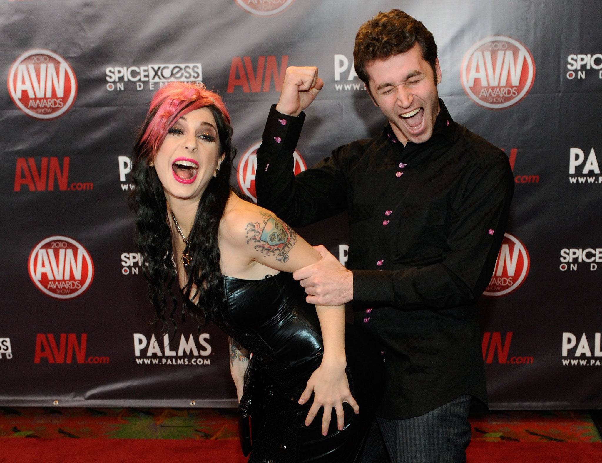 Adult film actor James Deen, pictured here with actress Joanna Angel, shot a feature film alongside actress Lindsay Lohan (Getty)