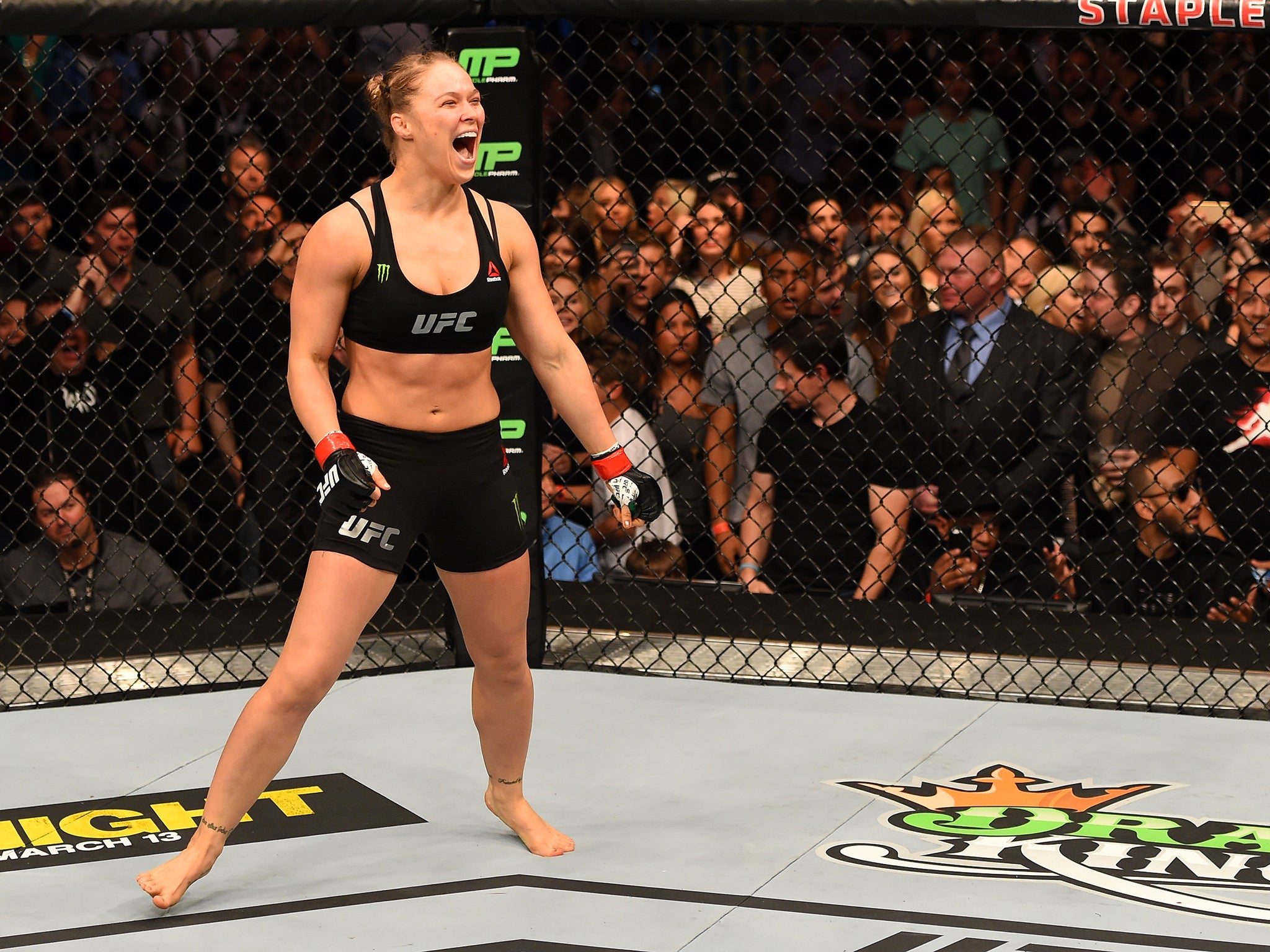 Rousey celebrates her UFC 184 victory over Zingano