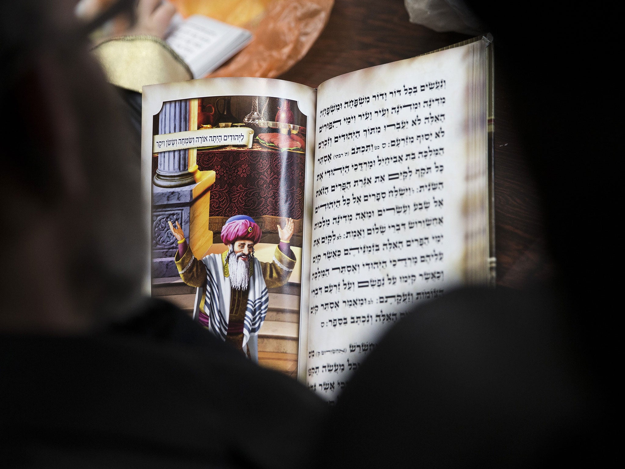 Ultra-Orthodox Jews read the Esther book at a synagogue in the Israel (Getty Images)