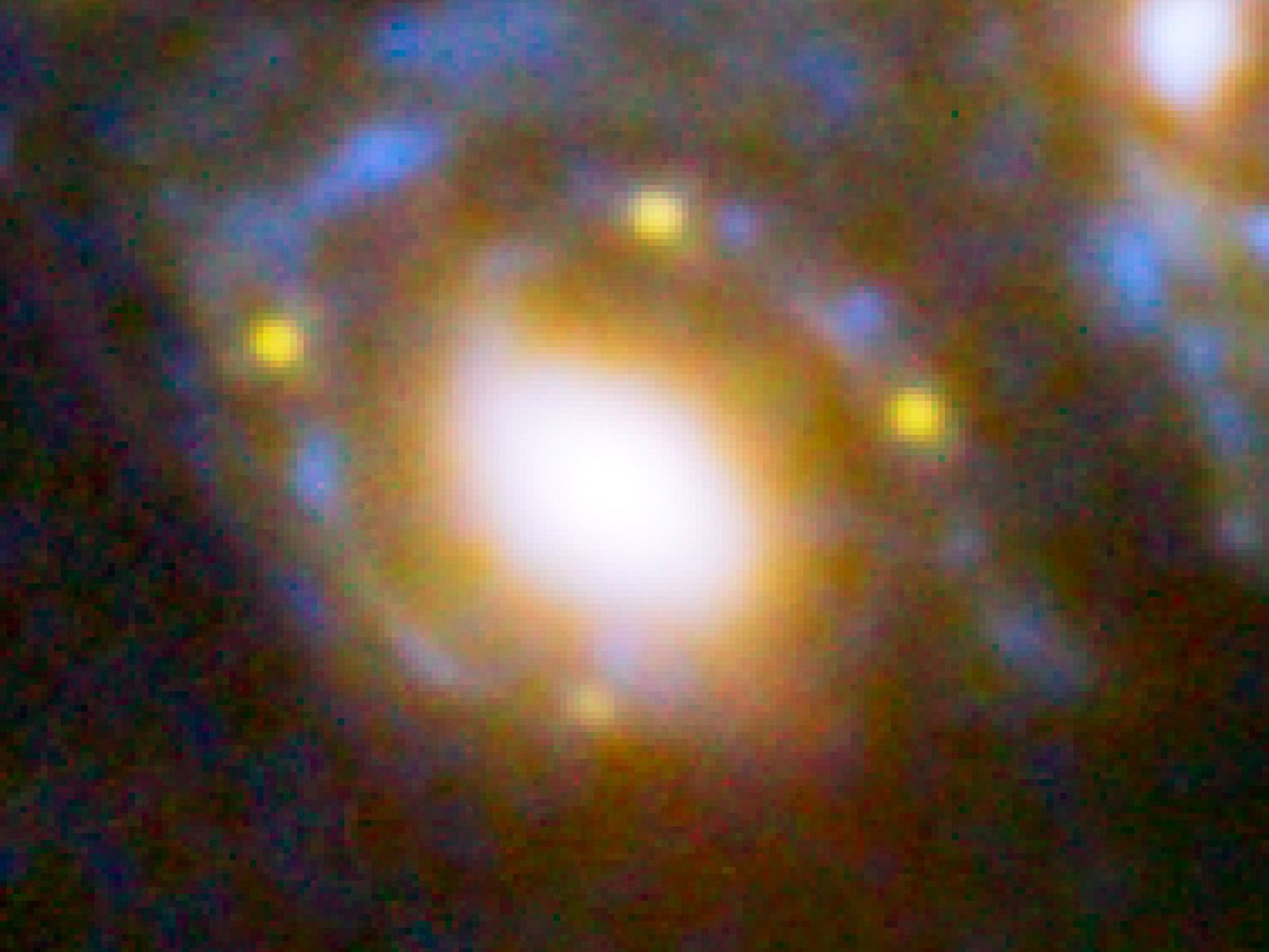 The supernova’s four points of light forming an ‘Einstein
cross