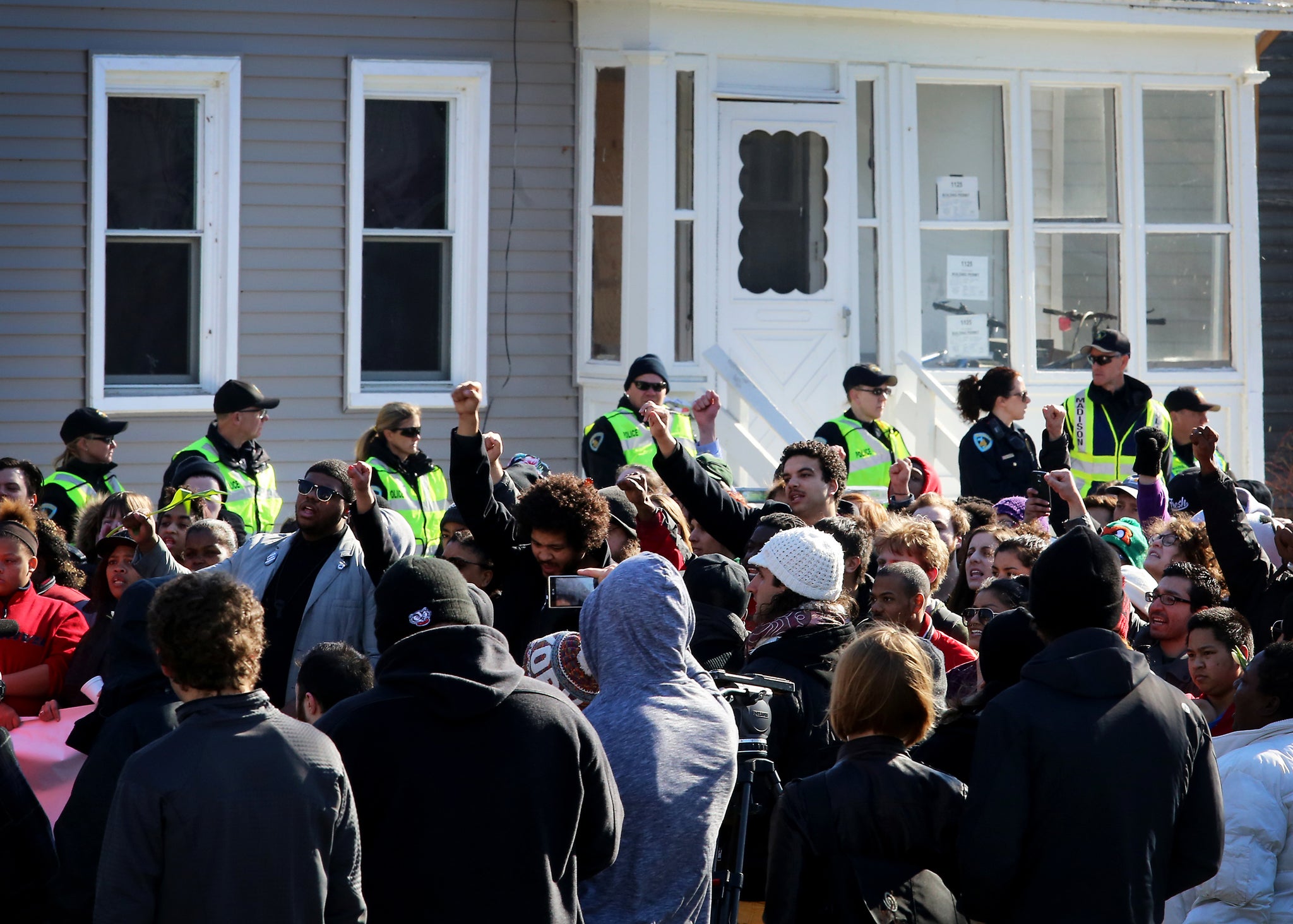 Protestors gather during a rally on Saturday 7 March in Madison, Wisconsin, against the shooting of Tony Robinson