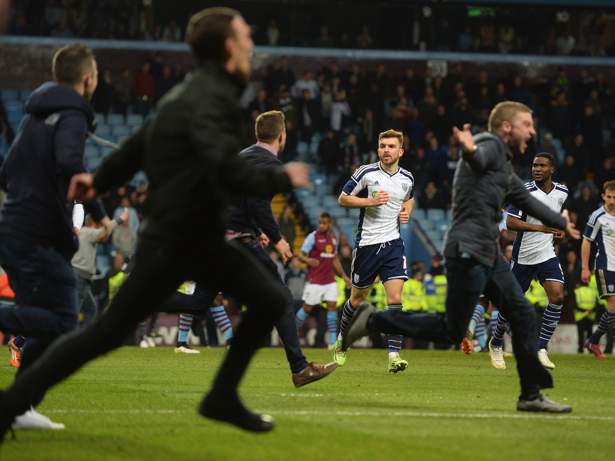 A view of the scenes as fans entered the pitch