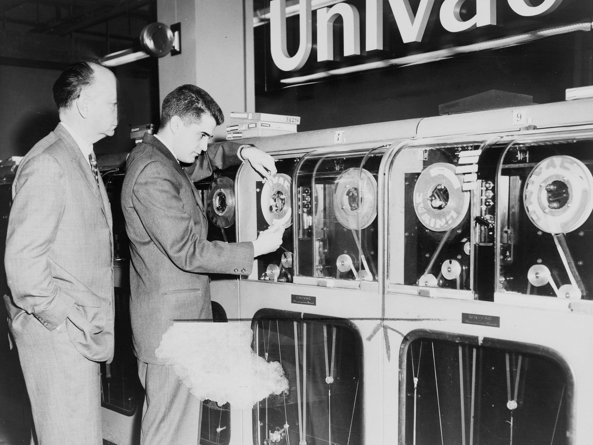 Photograph of a Univac computer being prepared to predict the winning horses in 1959