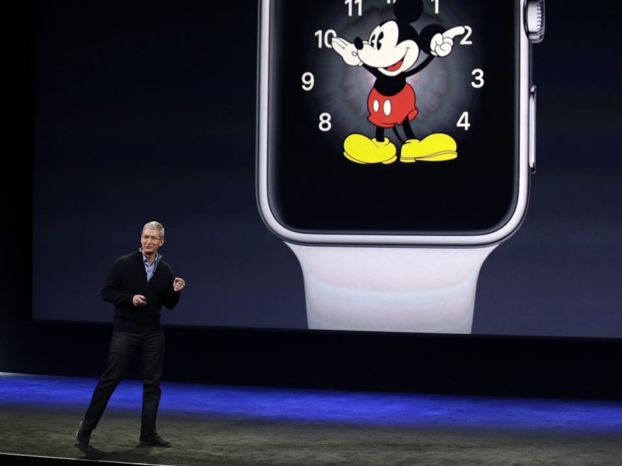 Apple CEO Tim Cook stood in front of the Mickey Mouse watchface, one of ten created by the company